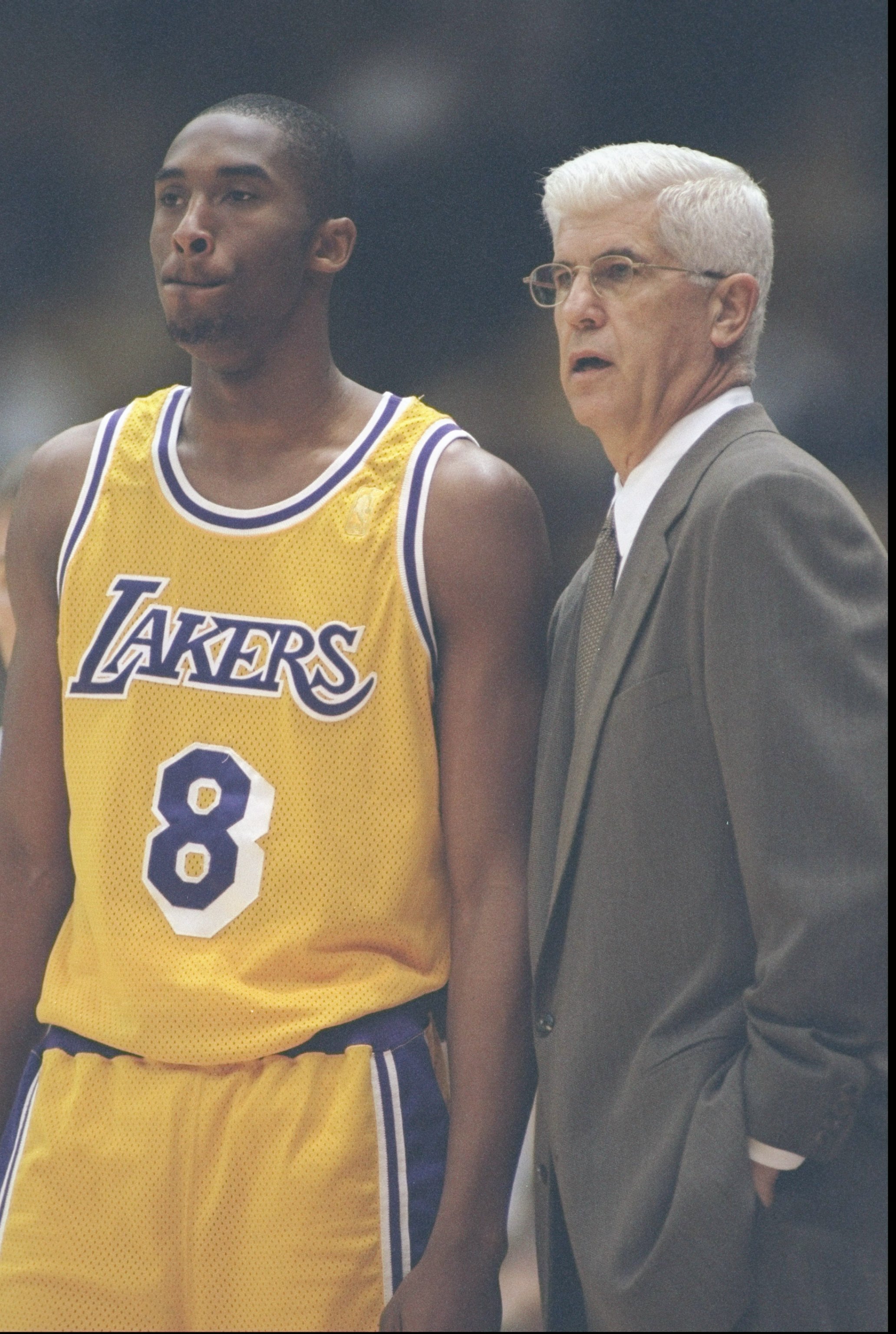 20 Jan 1997:  Coach Del Harris and guard Kobe Bryant of the Los Angeles Lakers speak to each other during a game against the Dallas Mavericks at the Great Western Forum in Inglewood, California.  The Lakers won the game 109-99. Mandatory Credit: Jamie Squ