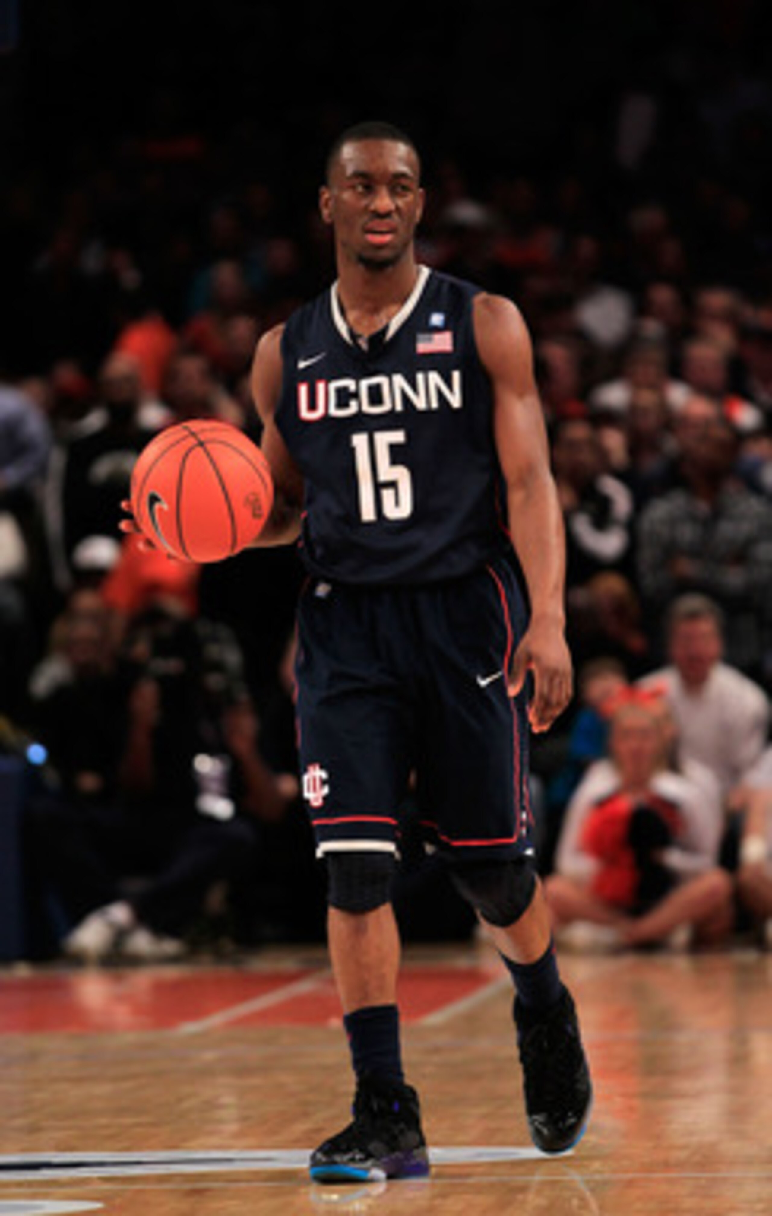 NEW YORK, NY - MARCH 11: Kemba Walker #15 of the Connecticut Huskies dribbles up court against the Syracuse Orange during the semifinals of the 2011 Big East Men's Basketball Tournament presented by American Eagle Outfitters at Madison Square Garden on Ma