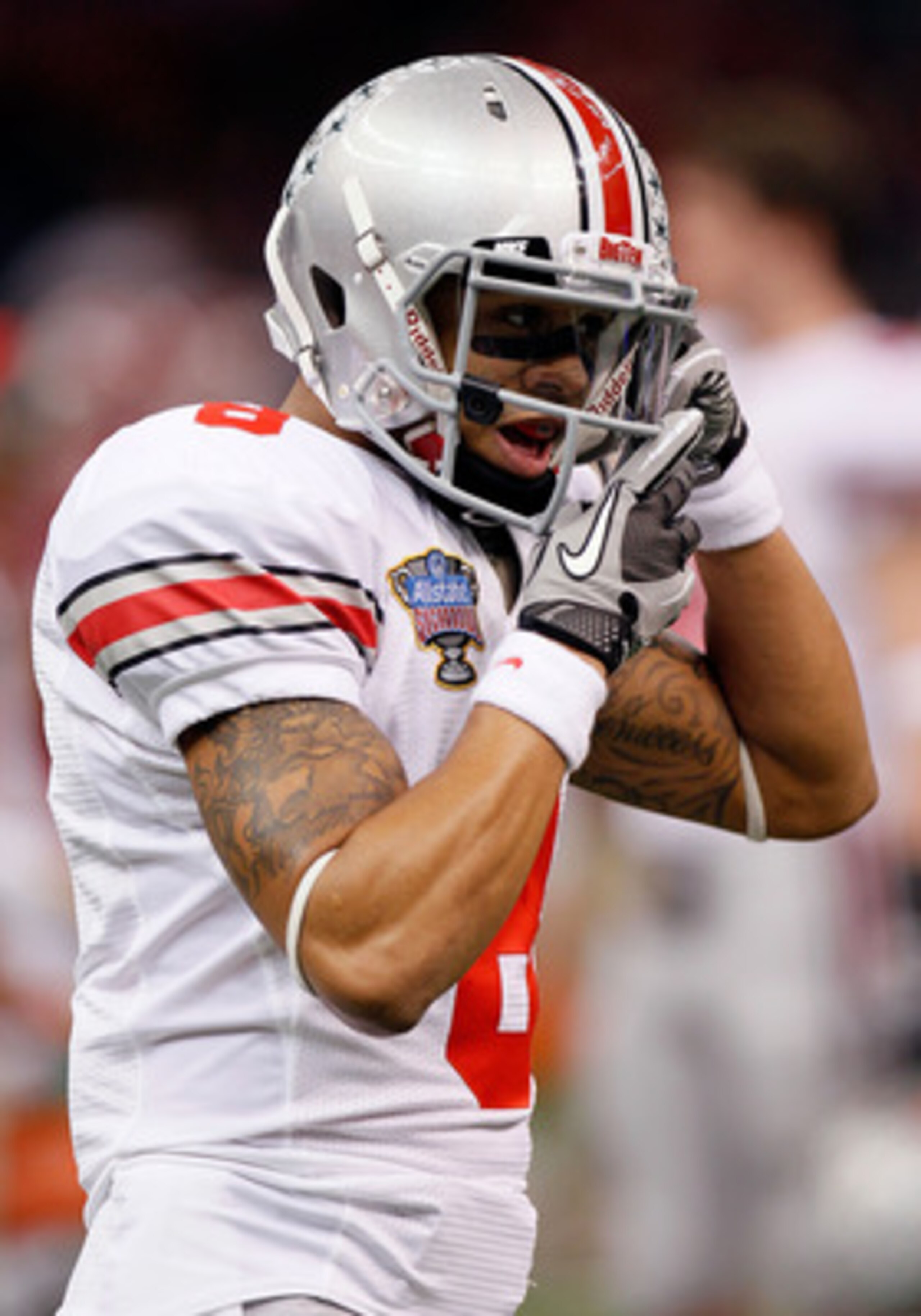 NEW ORLEANS, LA - JANUARY 04:  DeVier Posey #8 of the Ohio State Buckeyes fixes his helmet before taking on the Arkansas Razorbacks in the Allstate Sugar Bowl at the Louisiana Superdome on January 4, 2011 in New Orleans, Louisiana.  (Photo by Kevin C. Cox