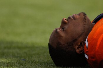 DENVER - NOVEMBER 14:  Wide receiver Eddie Royal #19 of the Denver Broncos gathers his thoughts while stretching before taking on the Kansas City Chiefs at INVESCO Field at Mile High on November 14, 2010 in Denver, Colorado. The Denver Broncos defeated th