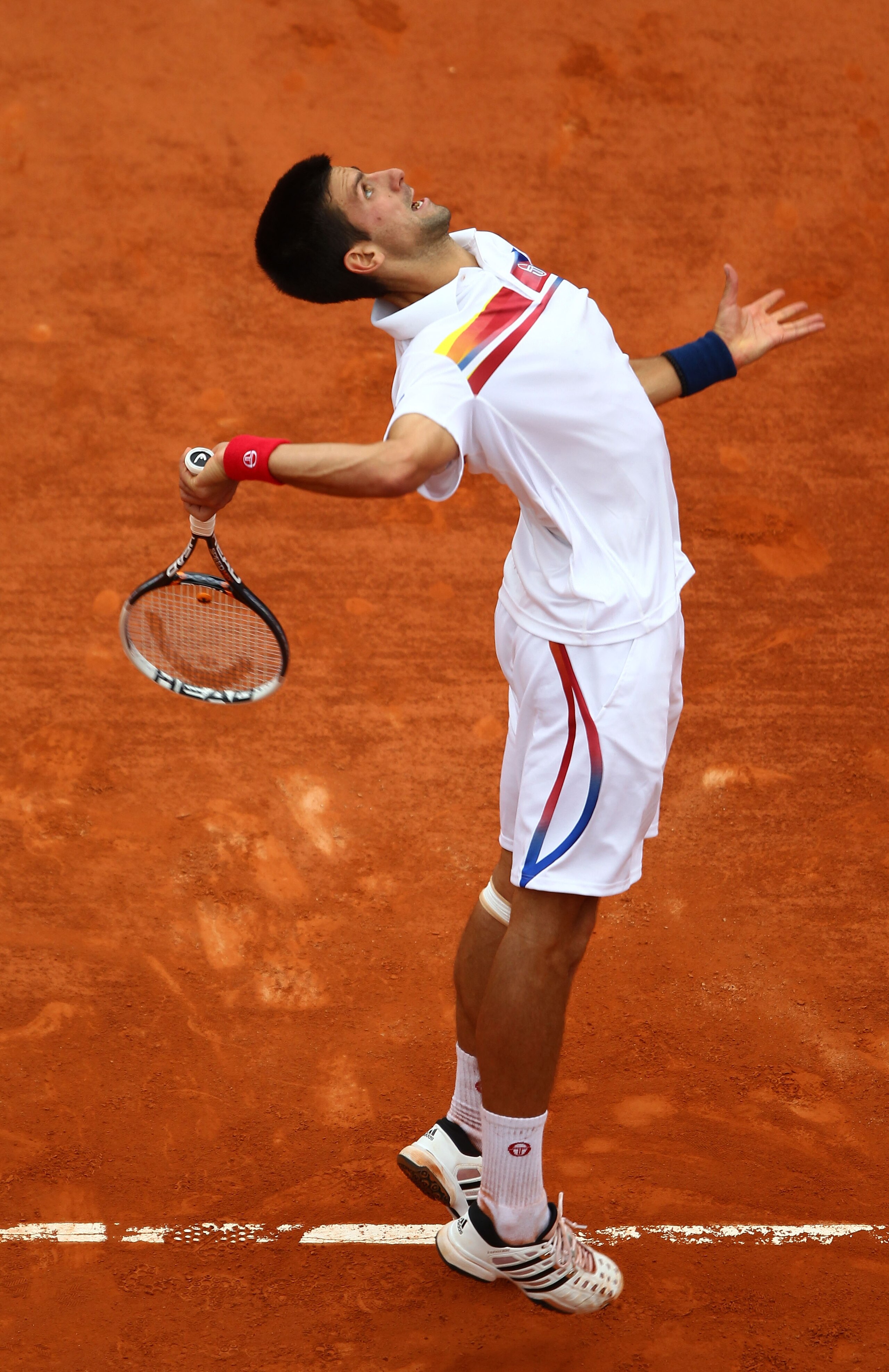 PARIS, FRANCE - JUNE 03:  Novak Djokovic of Serbia serves during the men's singles semi final match between Roger Federer of Switzerland and Novak Djokovic of Serbia on day thirteen of the French Open at Roland Garros on June 3, 2011 in Paris, France.  (P
