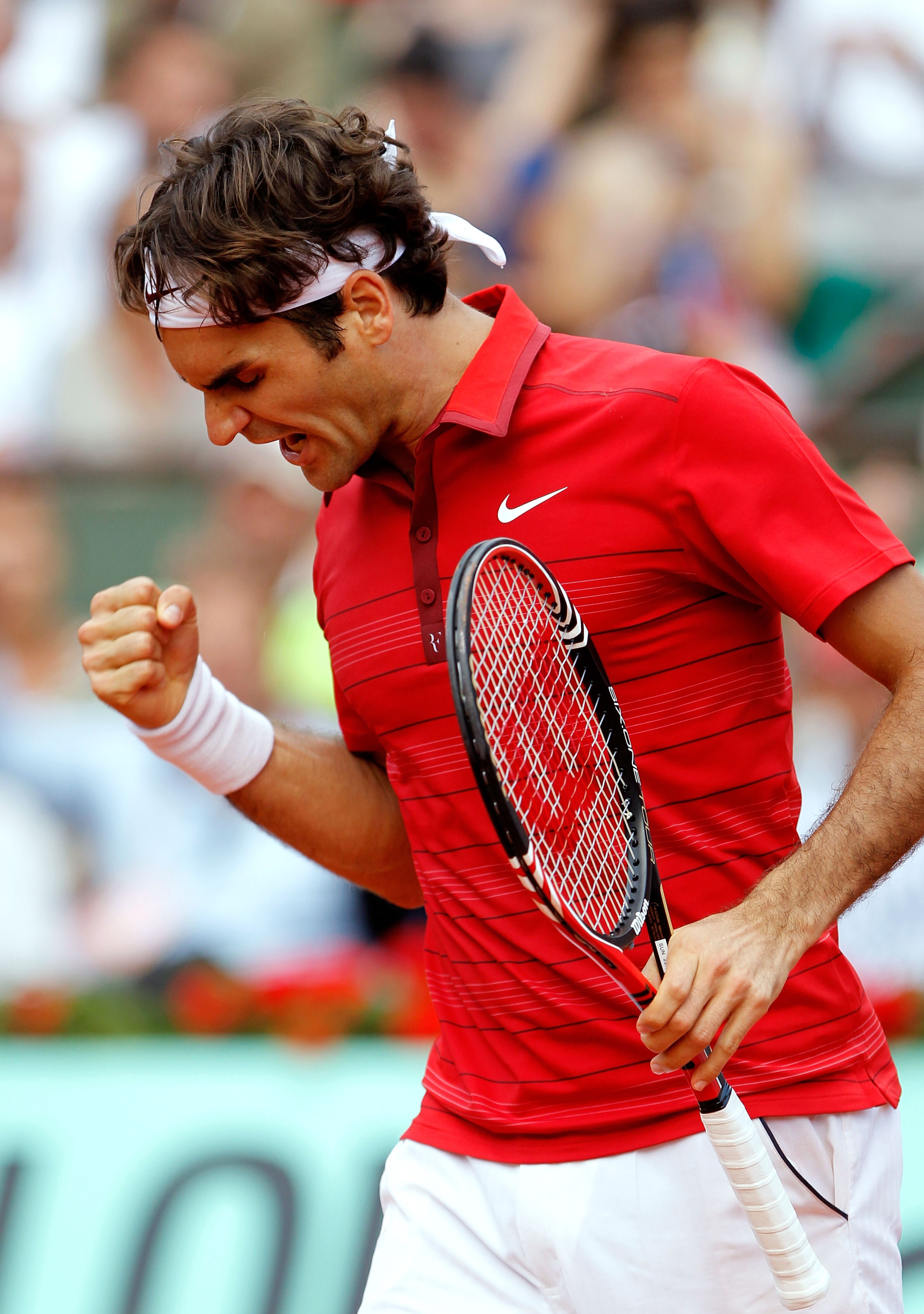 PARIS, FRANCE - JUNE 05:  Roger Federer of Switzerland celebrates a point during the men's singles final match between Rafael Nadal of Spain and Roger Federer of Switzerland on day fifteen of the French Open at Roland Garros on June 5, 2011 in Paris, Fran