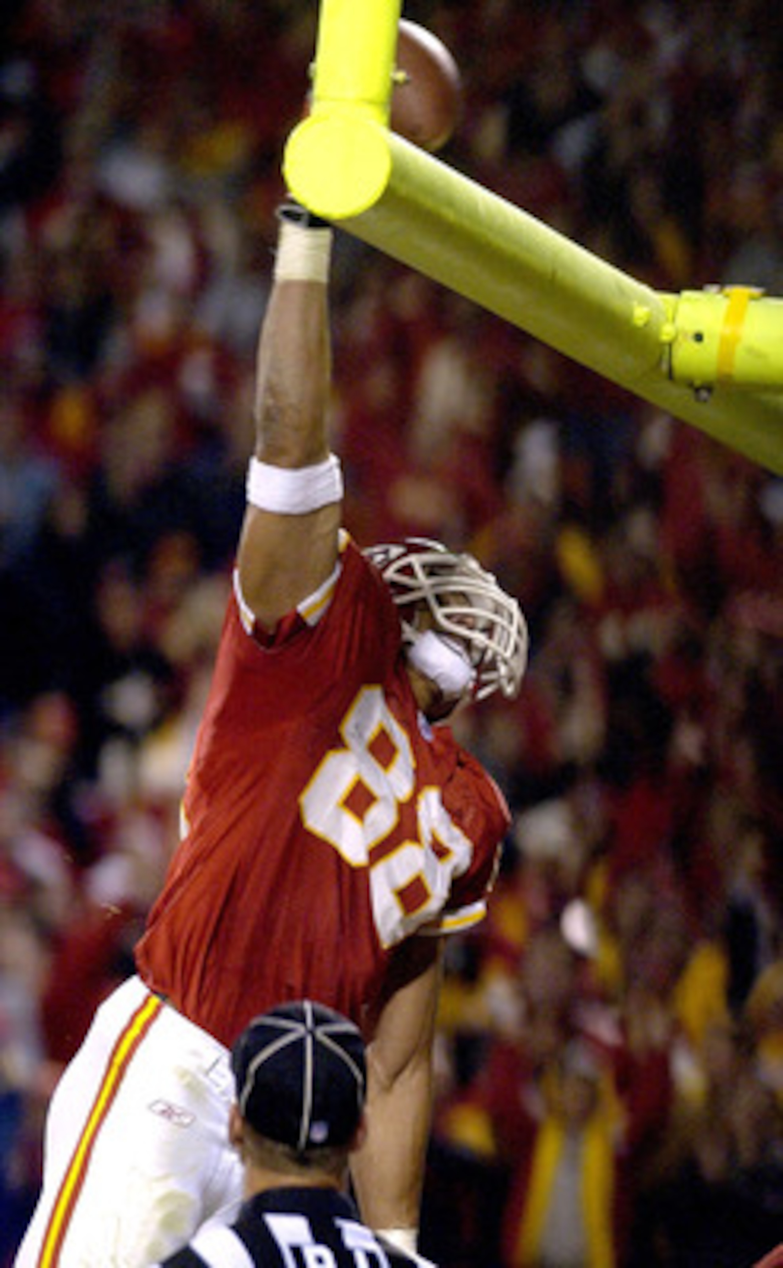 KANSAS CITY, MO - OCTOBER 26:  Tight end Tony Gonzalez #88 of the Kansas City Chiefs dunks the football over the goal post after scoring a touchdown against the Buffalo Bills October 26, 2003 at Arrowhead Stadium in Kansas City, Missouri.  (Photo by Dave 