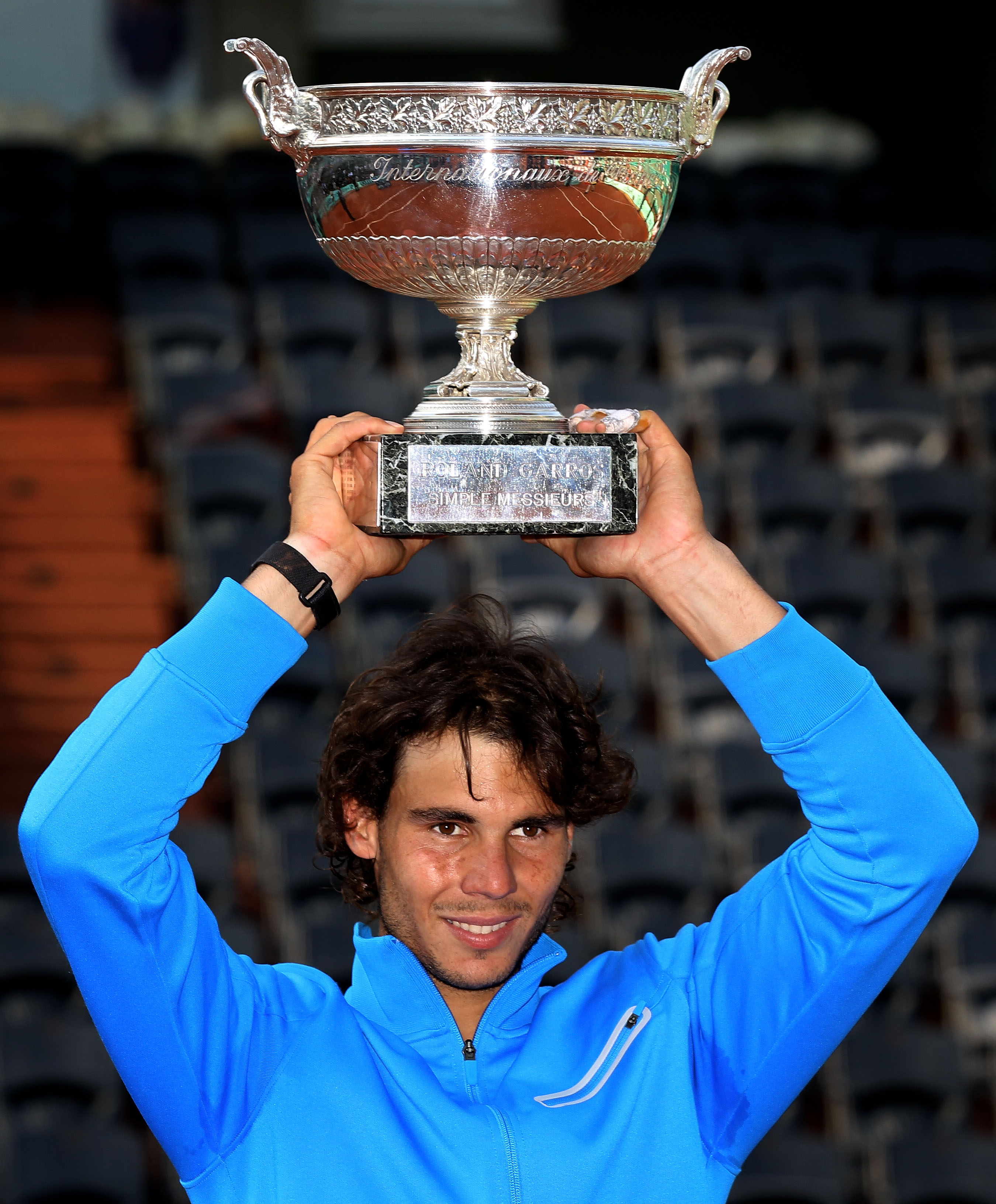 PARIS, FRANCE - JUNE 05:  Champion Rafael Nadal of Spain poses with the trophy following his victory during the men's singles final match between Rafael Nadal of Spain and Roger Federer of Switzerland on day fifteen of the French Open at Roland Garros on