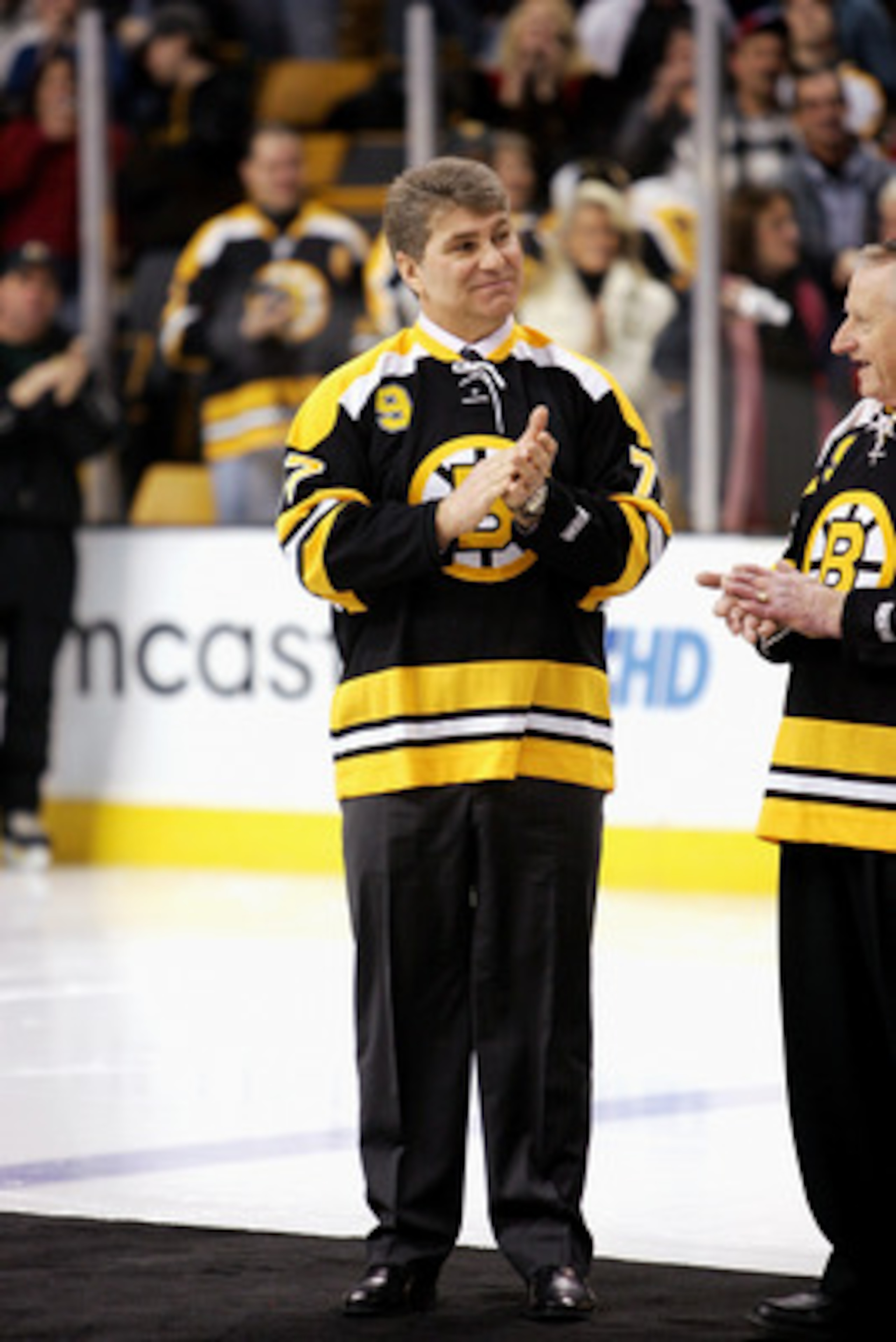 BOSTON - FEBRUARY 13: Former Boston Bruins player Ray Bourque claps his hands during the ceremony honoring John Bucyk for his 50 years with the Bruins organization before the game against the Edmonton Oilers on February 13, 2007 at TD Banknorth Garden in BOSTON - FEBRUARY 13: Former Boston Bruins player Ray Bourque claps his hands during the ceremony honoring John Bucyk for his 50 years with the Bruins organization before the game against the Edmonton Oilers on February 13, 2007 at TD Banknorth Garden in
