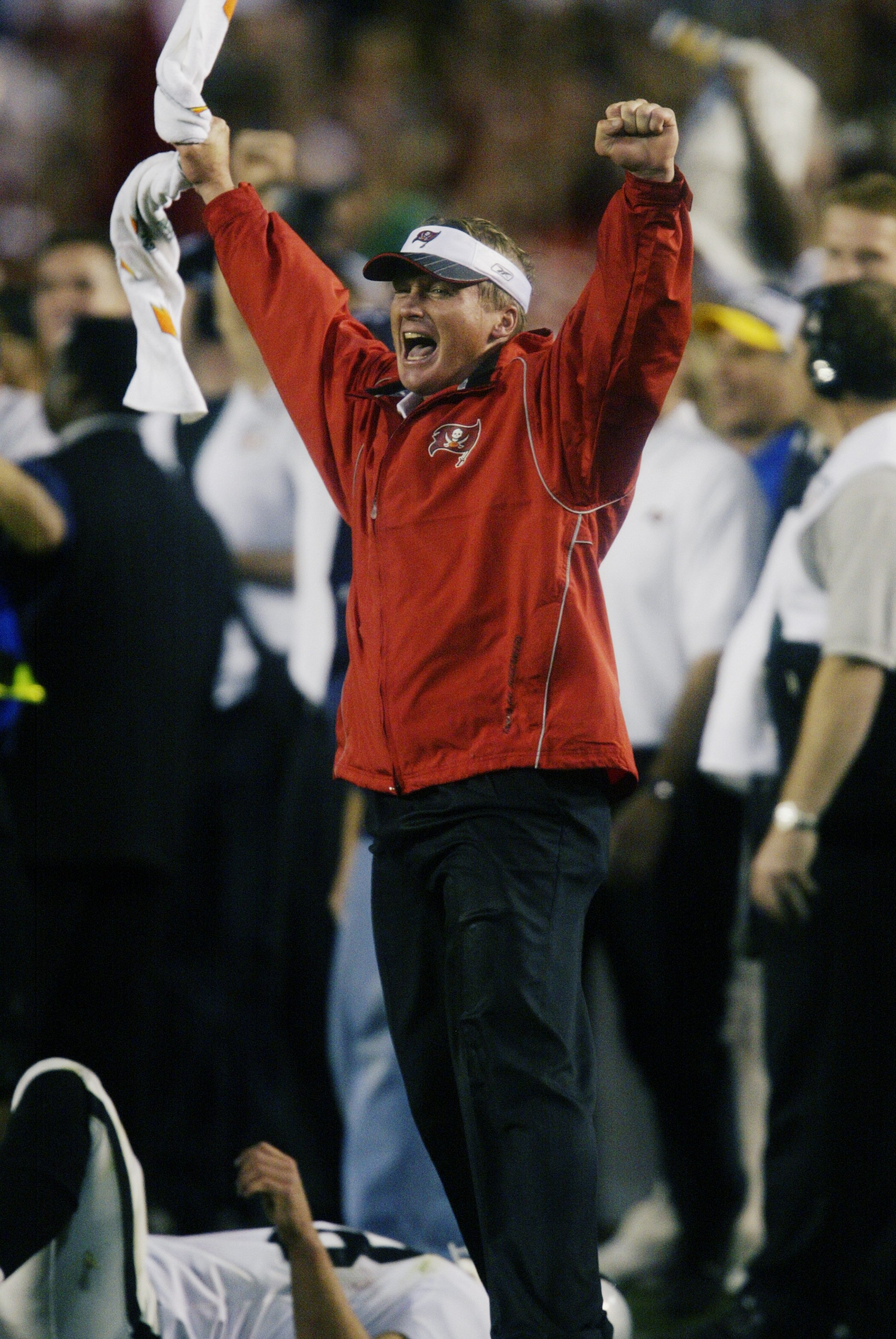 SAN DIEGO - JANUARY 26:  Head coach Jon Gruden of the Tampa Bay Buccaneers cheers as cornerback Dwight Smith makes a final touchdown off an Oakland Raiders fumble in the fourth quarter of Super Bowl XXXVII at Qualcomm Stadium on January 26, 2003 in San Di