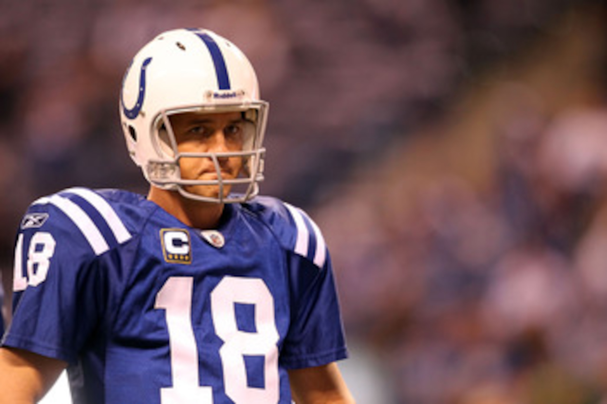 INDIANAPOLIS, IN - JANUARY 08:  Quarterback Peyton Manning #18 of the Indianapolis Colts looks on against the New York Jets during their 2011 AFC wild card playoff game at Lucas Oil Stadium on January 8, 2011 in Indianapolis, Indiana. The Jets won 17-16. 