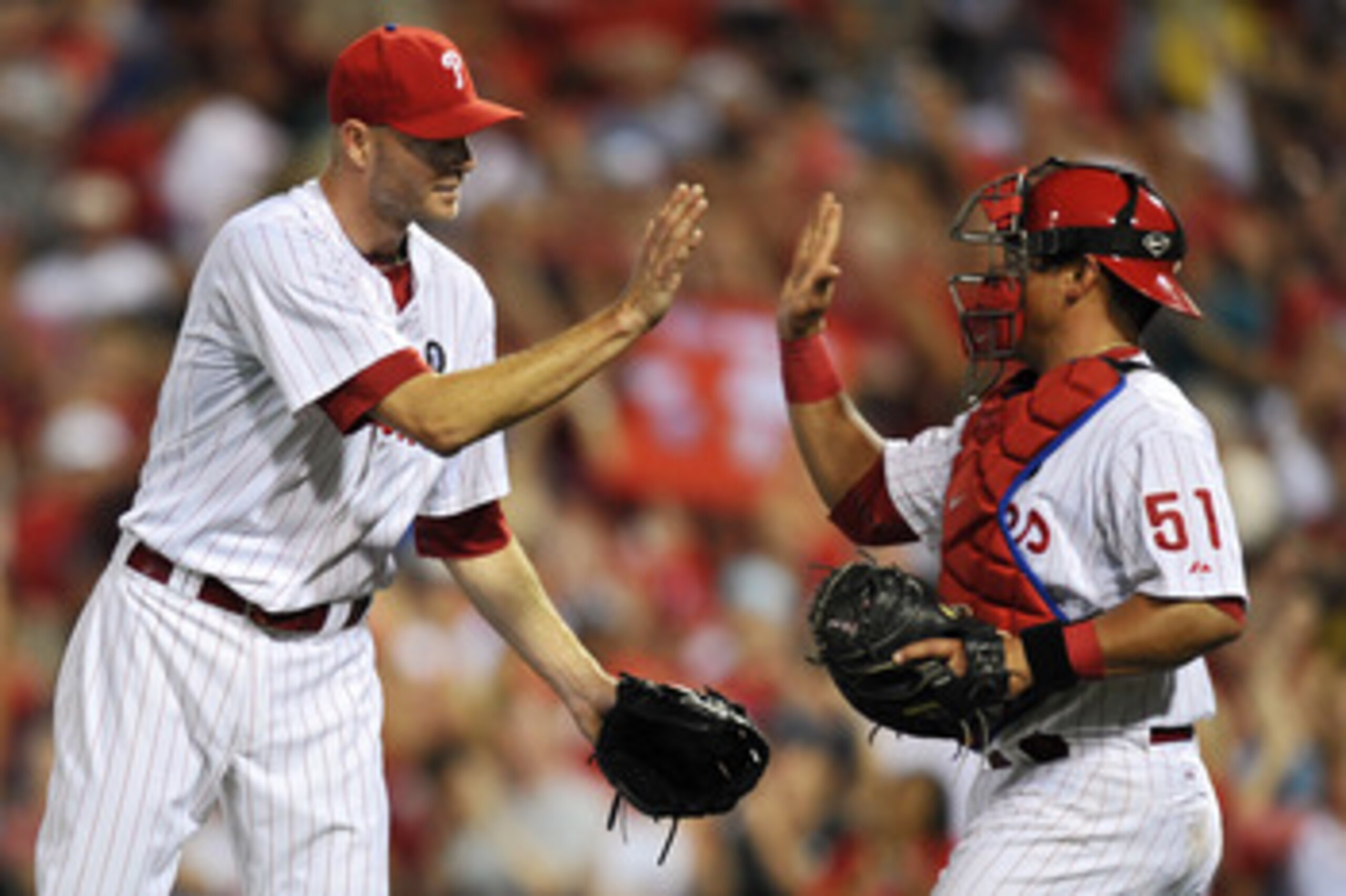 PHILADELPHIA, PA - JUNE 06: Closing pitcher Ryan Madson #46 and Carlos Ruiz #51 of the Philadelphia Phillies high-five after the game against the Los Angeles Dodgers at Citizens Bank Park on June 6, 2011 in Philadelphia, Pennsylvania. The Phillies won 3-1