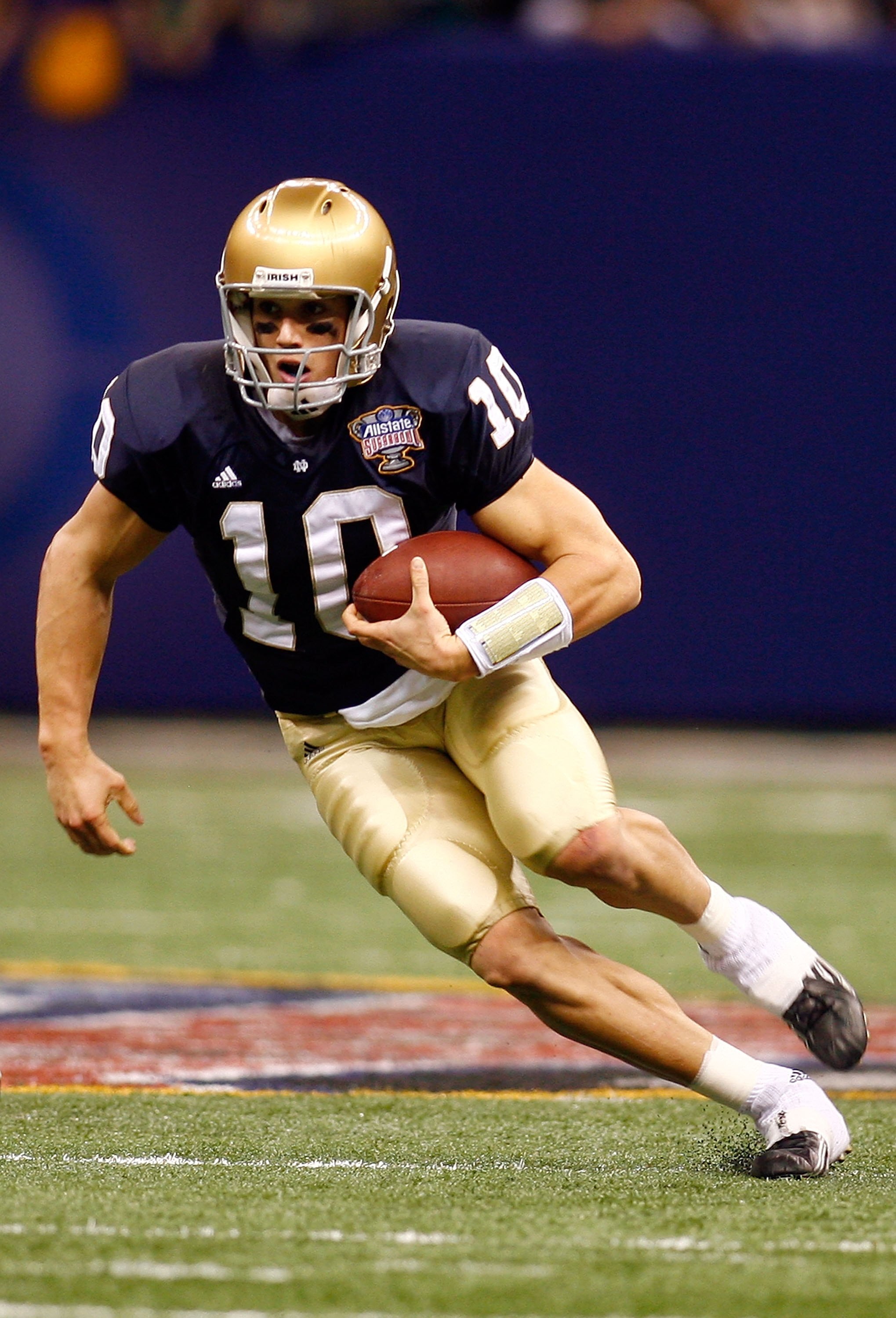 NEW ORLEANS - JANUARY 03:  Quarterback Brady Quinn #10 of the Notre Dame Fighting Irish runs with the ball in the first half of the 2007 Allstate Sugar Bowl against the LSU Tigers on January 3, 2007 at the Superdome in New Orleans, Louisiana.  (Photo by C