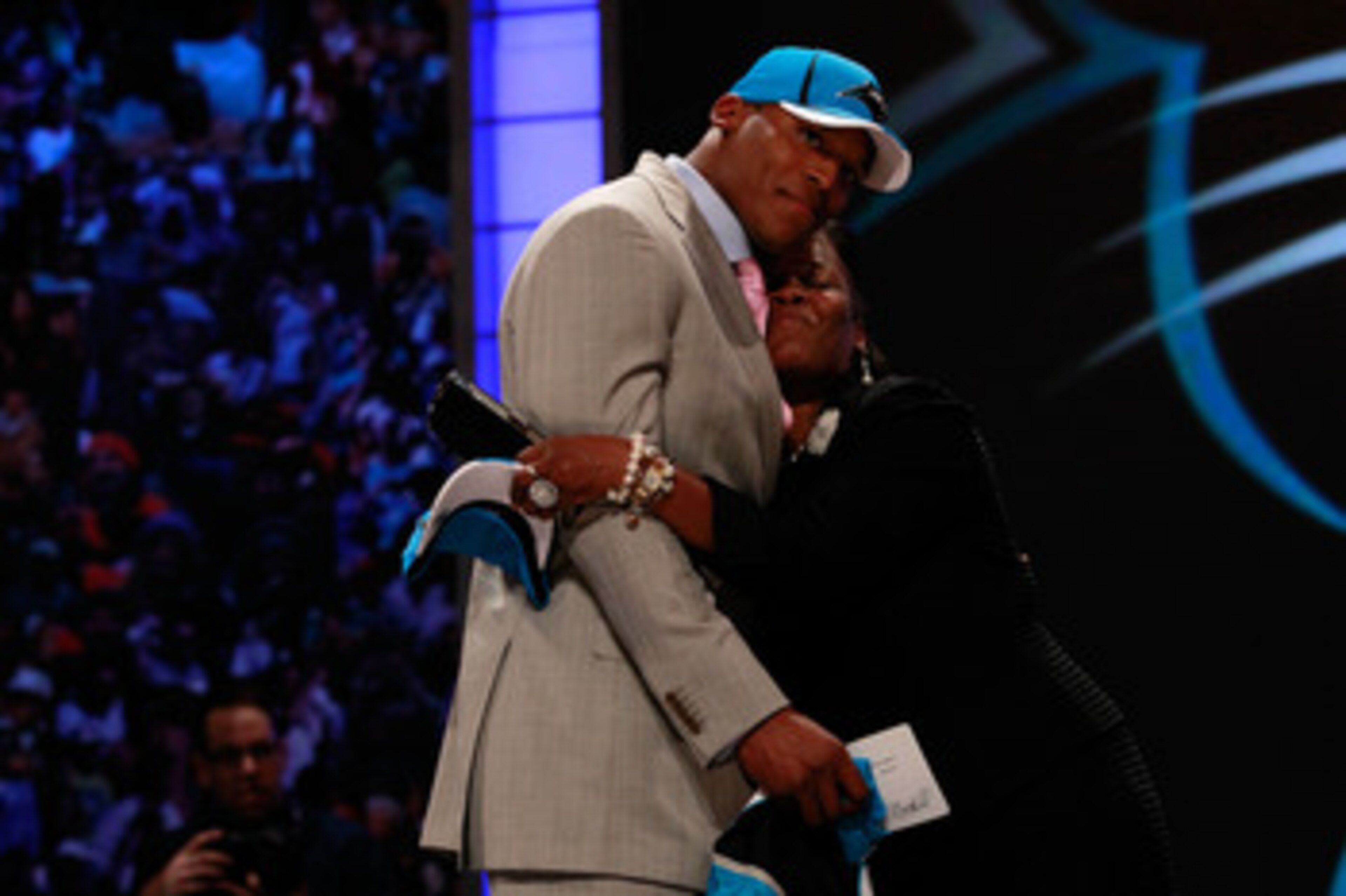 NEW YORK, NY - APRIL 28:  Cam Newton receives a hug from his mother Jackie on stage after he was selected #1 overall by the Carolina Panthers during the 2011 NFL Draft at Radio City Music Hall on April 28, 2011 in New York City.  (Photo by Chris Trotman/G