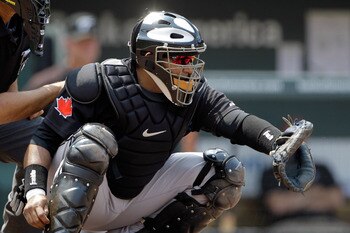 BALTIMORE, MD - JUNE 05:  Catcher Jose Molina #8 of the Toronto Blue Jays in action against the Baltimore Orioles at Oriole Park at Camden Yards on June 5, 2011 in Baltimore, Maryland.  (Photo by Rob Carr/Getty Images)