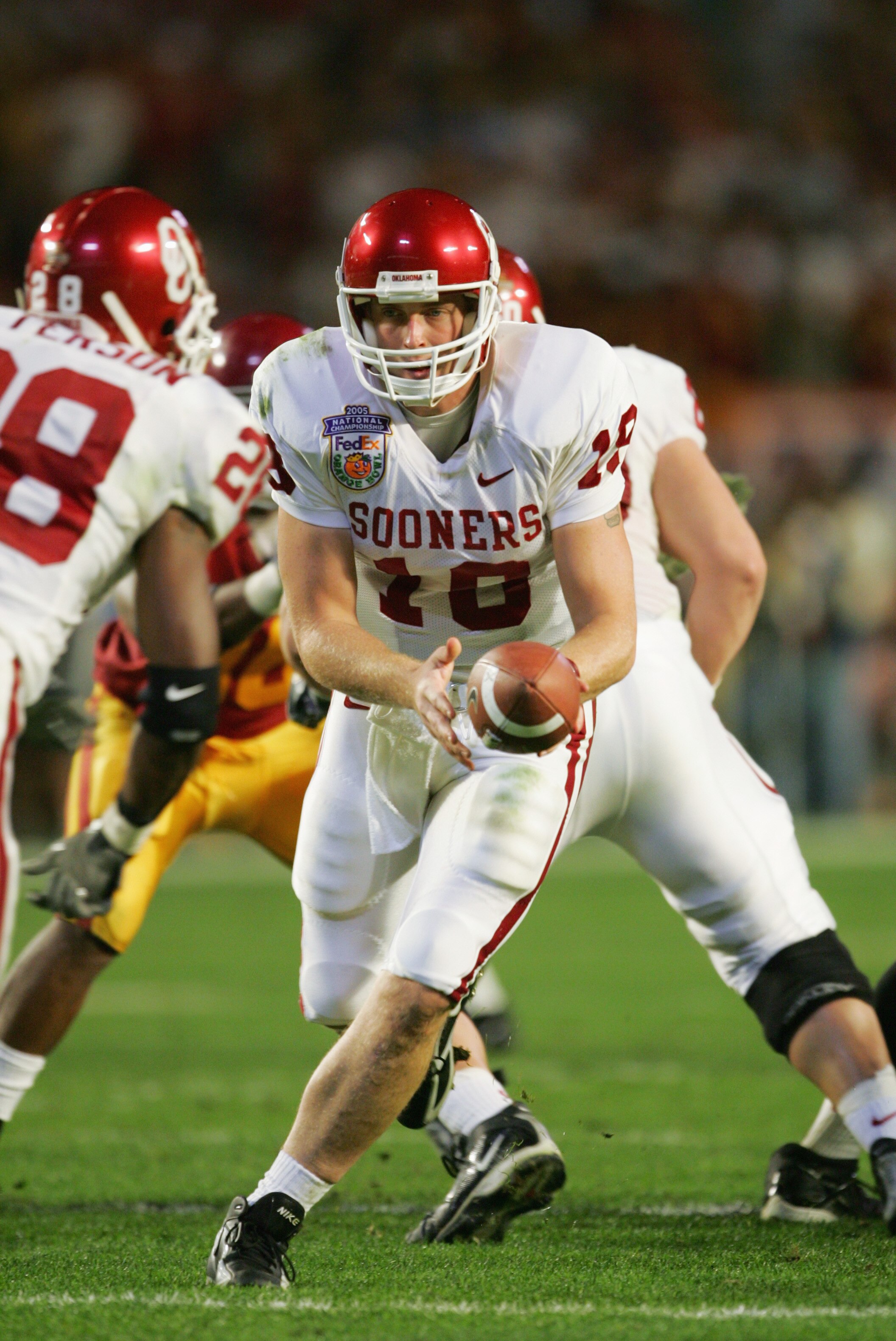 MIAMI - JANUARY 4:  Quarterback Jason White #18 of the Oklahoma Sooners looks to hand-off against the USC Trojans in the 2005 FedEx Orange Bowl National Championship on January 4, 2005 at Pro Player Stadium in Miami, Florida.  USC defeated Oklahoma 55-19.