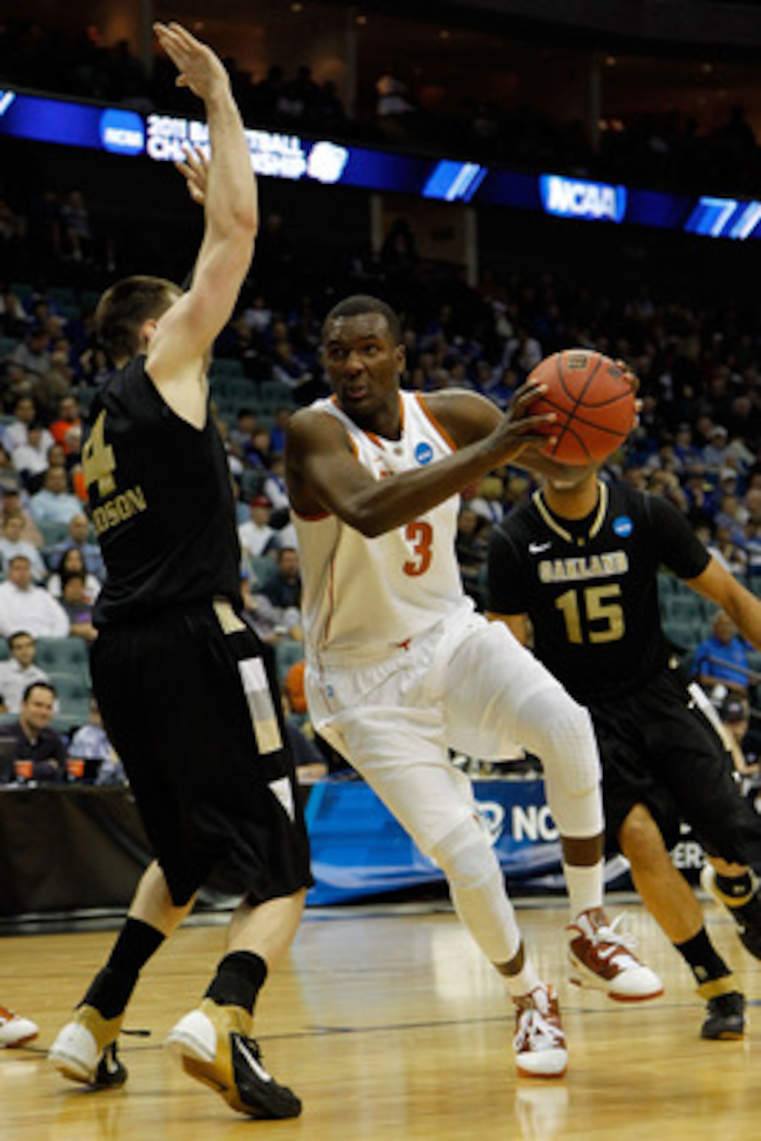 TULSA, OK - MARCH 18:  Jordan Hamilton #3 of the Texas Longhorns drives with the ball against Will Hudson #4 of the Oakland Golden Grizzlies during the second round of the 2011 NCAA men's basketball tournament at BOK Center on March 18, 2011 in Tulsa, Okl