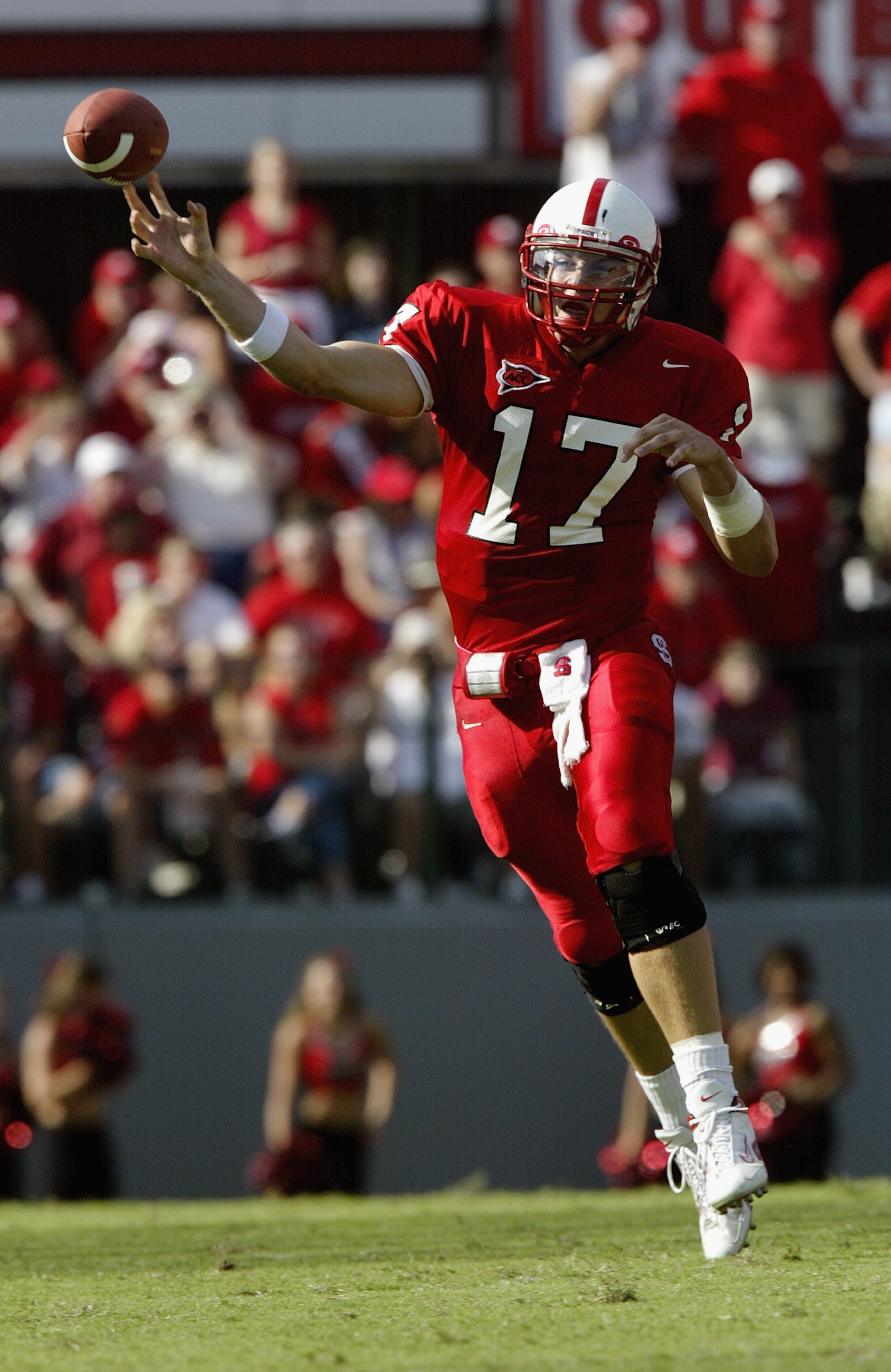 RALEIGH, NC - SEPTEMBER 27: Quarterback Philip Rivers #17 of the North Carolina State University Wolfpack passes the ball during their game against the University of North Carolina at Chapel Hill Tar Heels on September 27, 2003 at Carter Finley Stadium i RALEIGH, NC - SEPTEMBER 27: Quarterback Philip Rivers #17 of the North Carolina State University Wolfpack passes the ball during their game against the University of North Carolina at Chapel Hill Tar Heels on September 27, 2003 at Carter Finley Stadium i