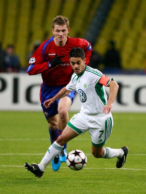 MOSCOW, RUSSIA - NOVEMBER 25: Tomas Necid (L) of CSKA Moscow competes for the ball with Josue of VfL Wolfsburg during the UEFA Champions League group B match between CSKA Moscow and VfL Wolfsburg at the Luzhniki Stadium on November 25, 2009 in Moscow, Rus