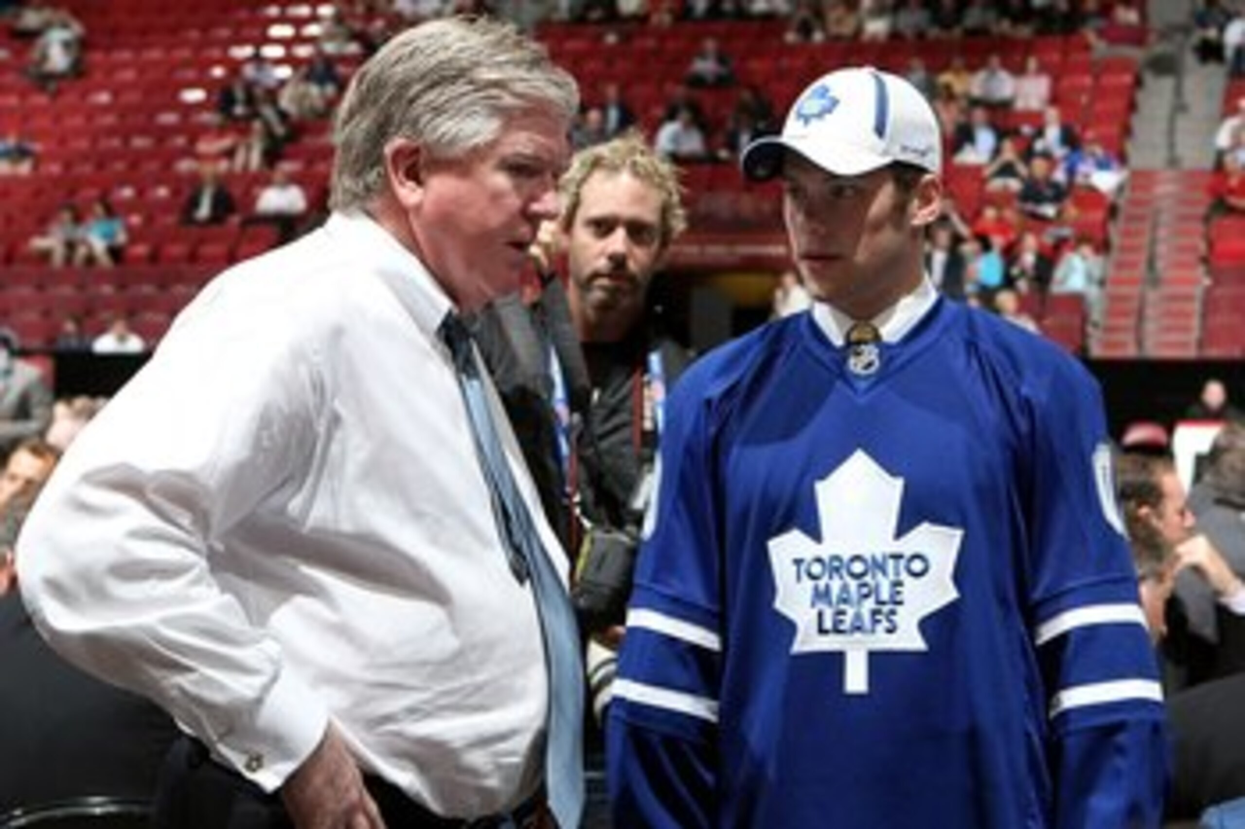 MONTREAL, QC - JUNE 27: Kenny Ryan speaks to General Manager Brian Burke of the Toronto Maple Leafs organization after he was drafted by the Leafs in the second round during the 2009 NHL Entry Draft at the Bell Centre on June 27, 2009 in Montreal, Quebec MONTREAL, QC - JUNE 27: Kenny Ryan speaks to General Manager Brian Burke of the Toronto Maple Leafs organization after he was drafted by the Leafs in the second round during the 2009 NHL Entry Draft at the Bell Centre on June 27, 2009 in Montreal, Quebec