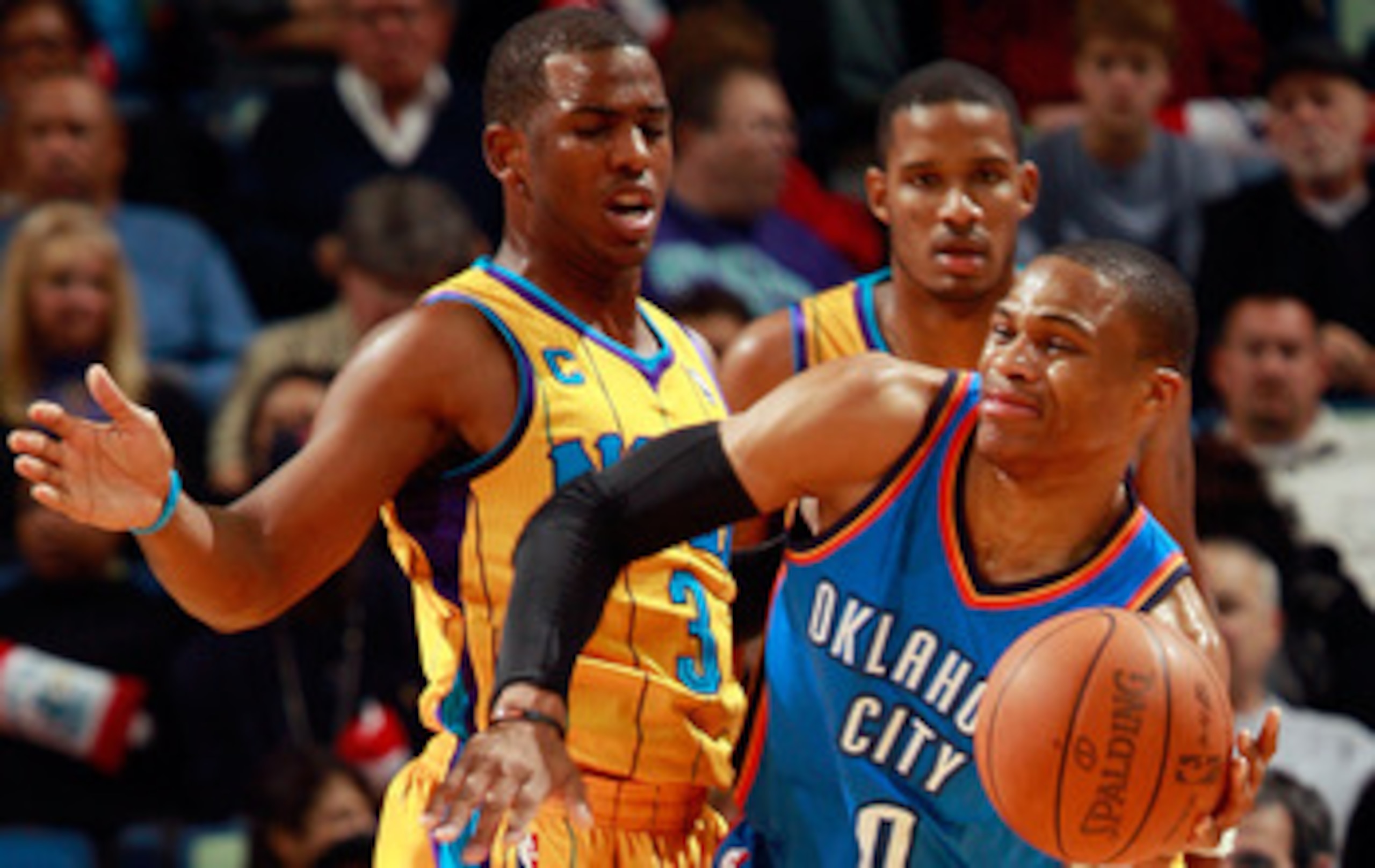NEW ORLEANS, LA - DECEMBER 10: Russell Westbrook #0 of the Oklahoma City Thunder passes the ball around Chris Paul #3 of the New Orleans Hornets at New Orleans Arena on December 10, 2010 in New Orleans, Louisiana. The Thunder defeated the Hornets 97- NEW ORLEANS, LA - DECEMBER 10: Russell Westbrook #0 of the Oklahoma City Thunder passes the ball around Chris Paul #3 of the New Orleans Hornets at New Orleans Arena on December 10, 2010 in New Orleans, Louisiana. The Thunder defeated the Hornets 97-