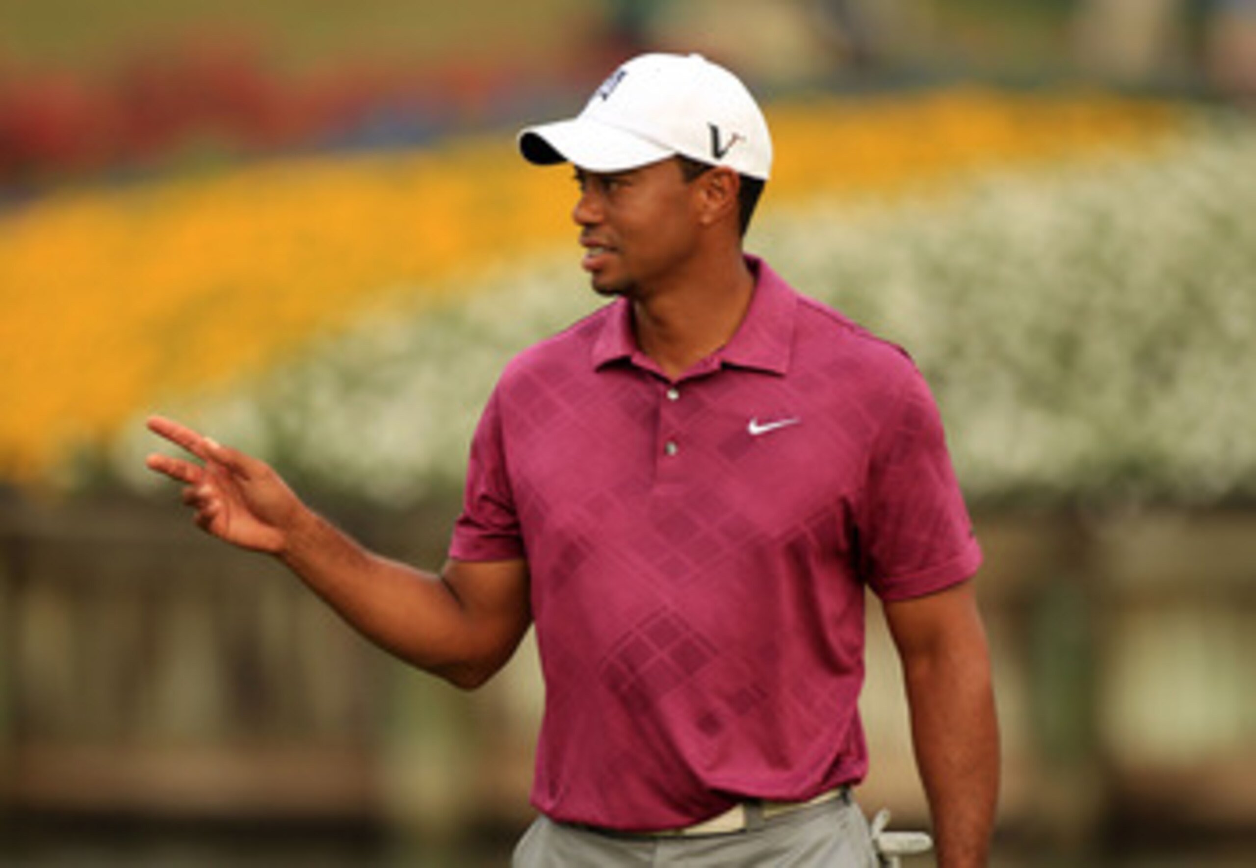 PONTE VEDRA BEACH, FL - MAY 11:  Tiger Woods reacts during a practice round prior to the start of THE PLAYERS Championship held at THE PLAYERS Stadium course at TPC Sawgrass on May 11, 2011 in Ponte Vedra Beach, Florida.  (Photo by Streeter Lecka/Getty Im