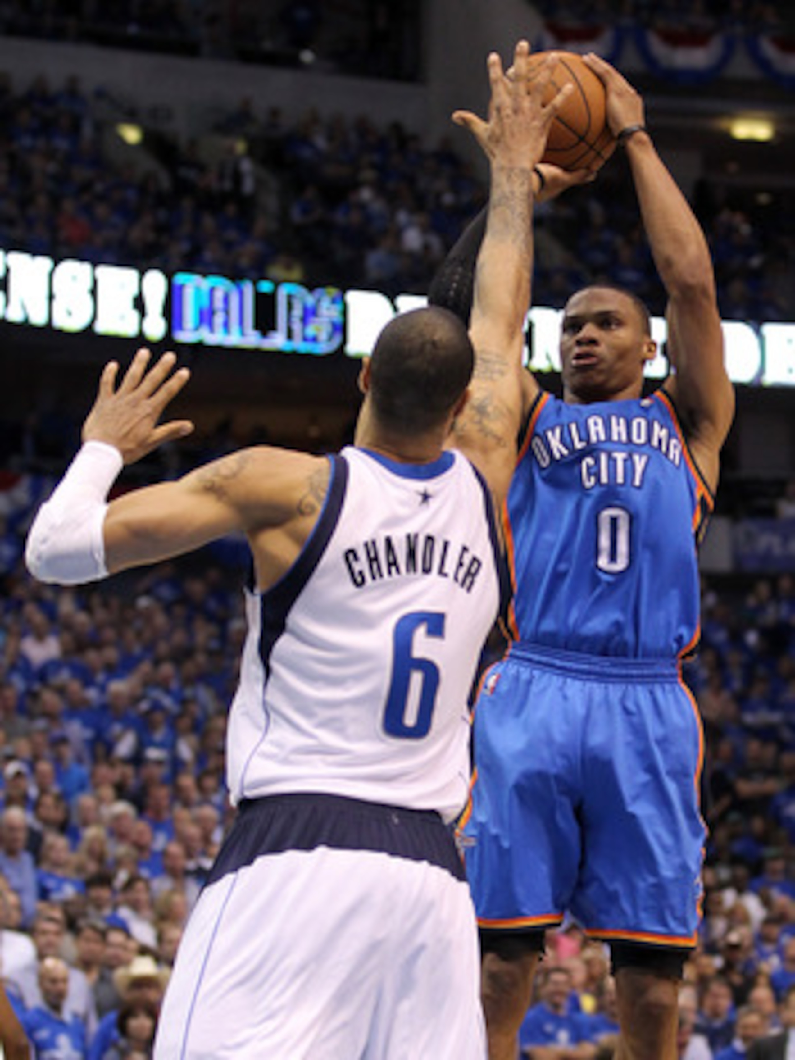 DALLAS, TX - MAY 25: Russell Westbrook #0 of the Oklahoma City Thunder shoots over Tyson Chandler #6 of the Dallas Mavericks in the fourth quarter in Game Five of the Western Conference Finals during the 2011 NBA Playoffs at American Airlines Center on M DALLAS, TX - MAY 25: Russell Westbrook #0 of the Oklahoma City Thunder shoots over Tyson Chandler #6 of the Dallas Mavericks in the fourth quarter in Game Five of the Western Conference Finals during the 2011 NBA Playoffs at American Airlines Center on M