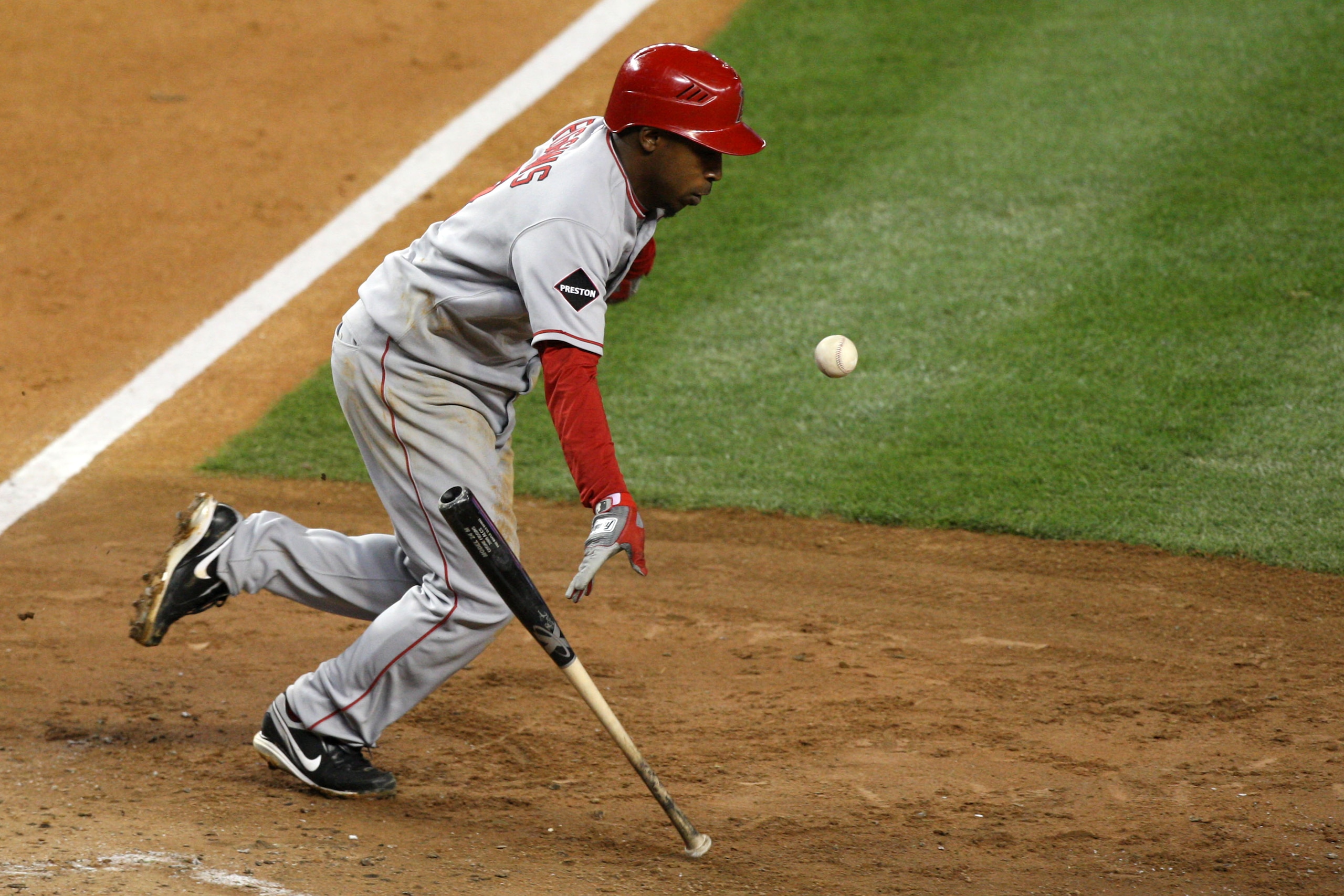NEW YORK - OCTOBER 25:  Chone Figgins #9 of the Los Angeles Angels of Anaheim bunts against the New York Yankees in Game Six of the ALCS during the 2009 MLB Playoffs at Yankee Stadium on October 25, 2009 in the Bronx borough of New York City.  (Photo by J
