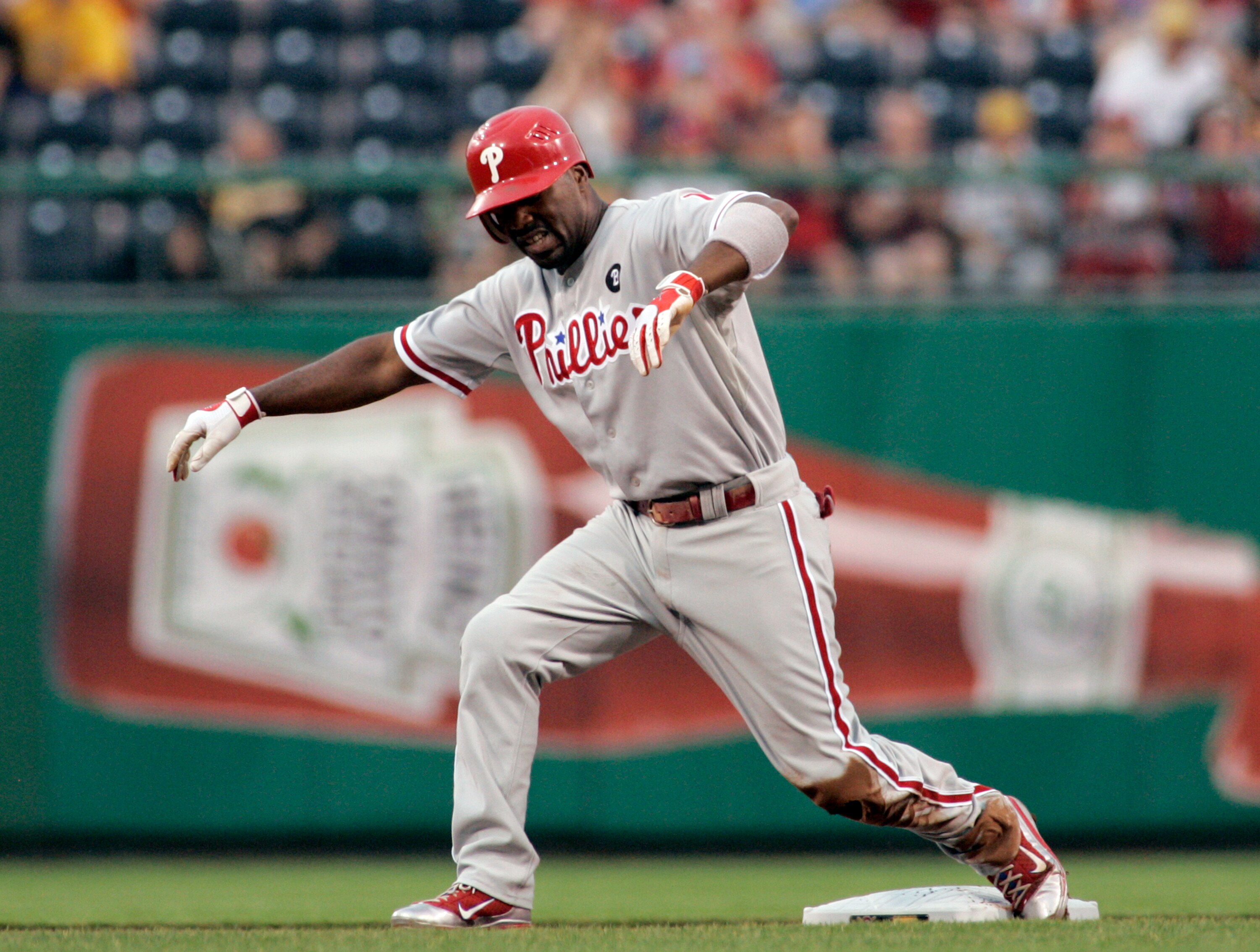 PITTSBURGH, PA - JUNE 04:  Jimmy Rollins #11 of the Philadelphia Phillies grimaces after sliding into second against the Pittsburgh Pirates during the game on June 4, 2011 at PNC Park in Pittsburgh, Pennsylvania.  The Pirates defeated the Phillies 6-3.  (