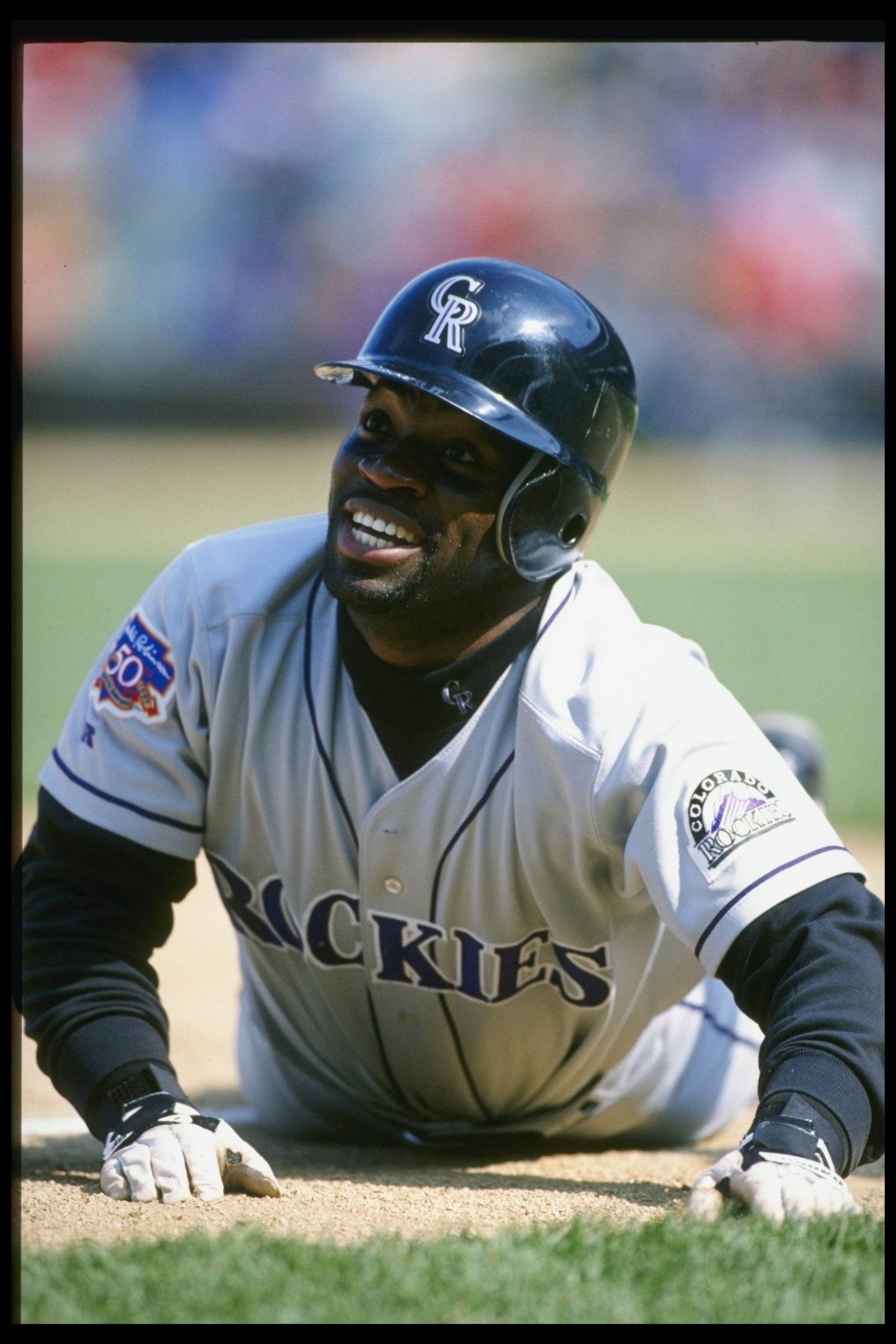 16 Apr 1997: Runner Eric Young of the Colorado Rockies slides into a base during the Rockies 4-0 win over the Chicago Cubsat Wrigley Field in Chicago, Illinois.