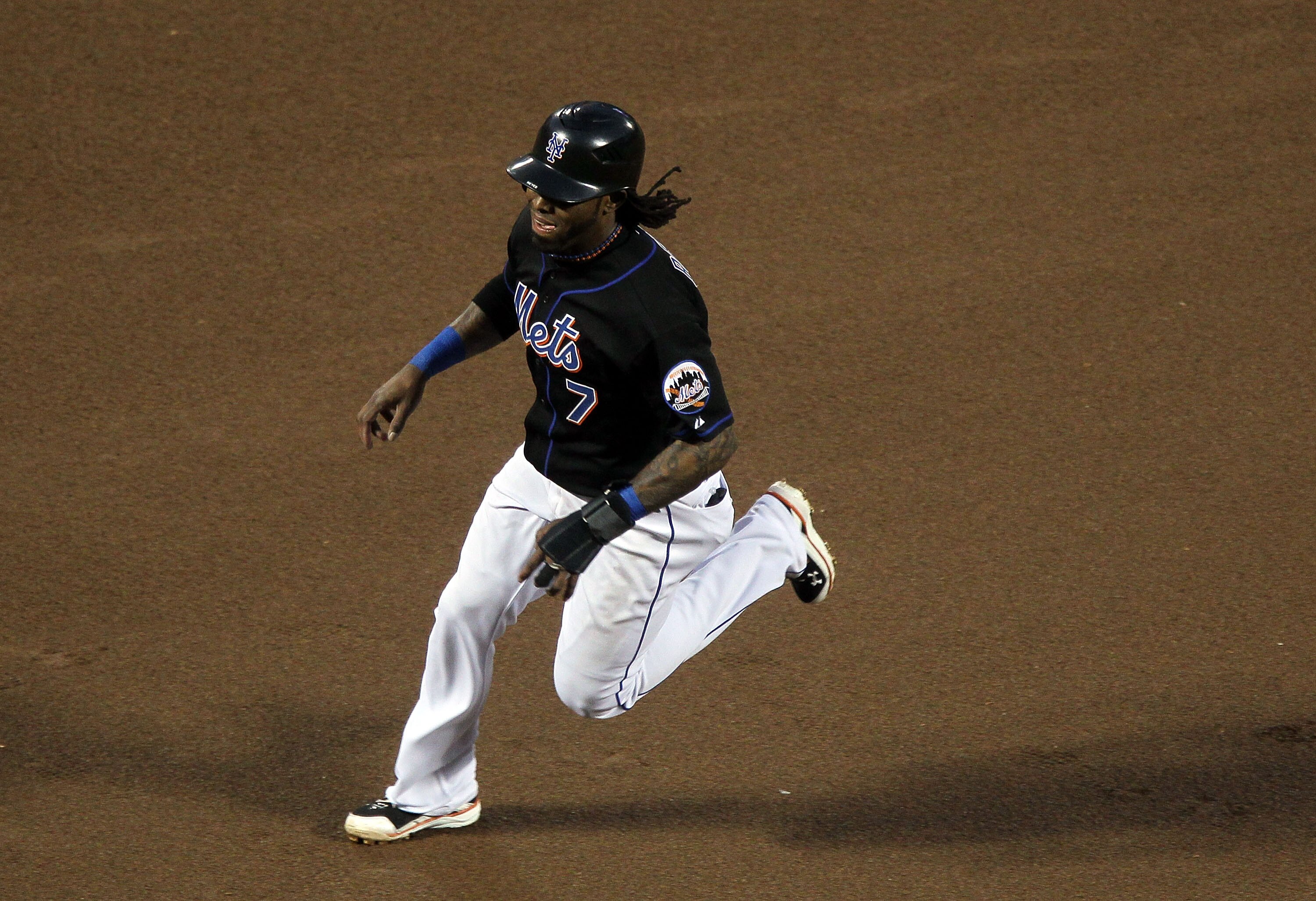 NEW YORK, NY - JUNE 05:  Jose Reyes #7 of the New York Mets rounds the bases to score a first inning run against the Atlanta Braves on a double from teammate Carlos Beltran (not pictured) on June 5, 2011 at Citi Field in the Flushing neighborhood of the Q