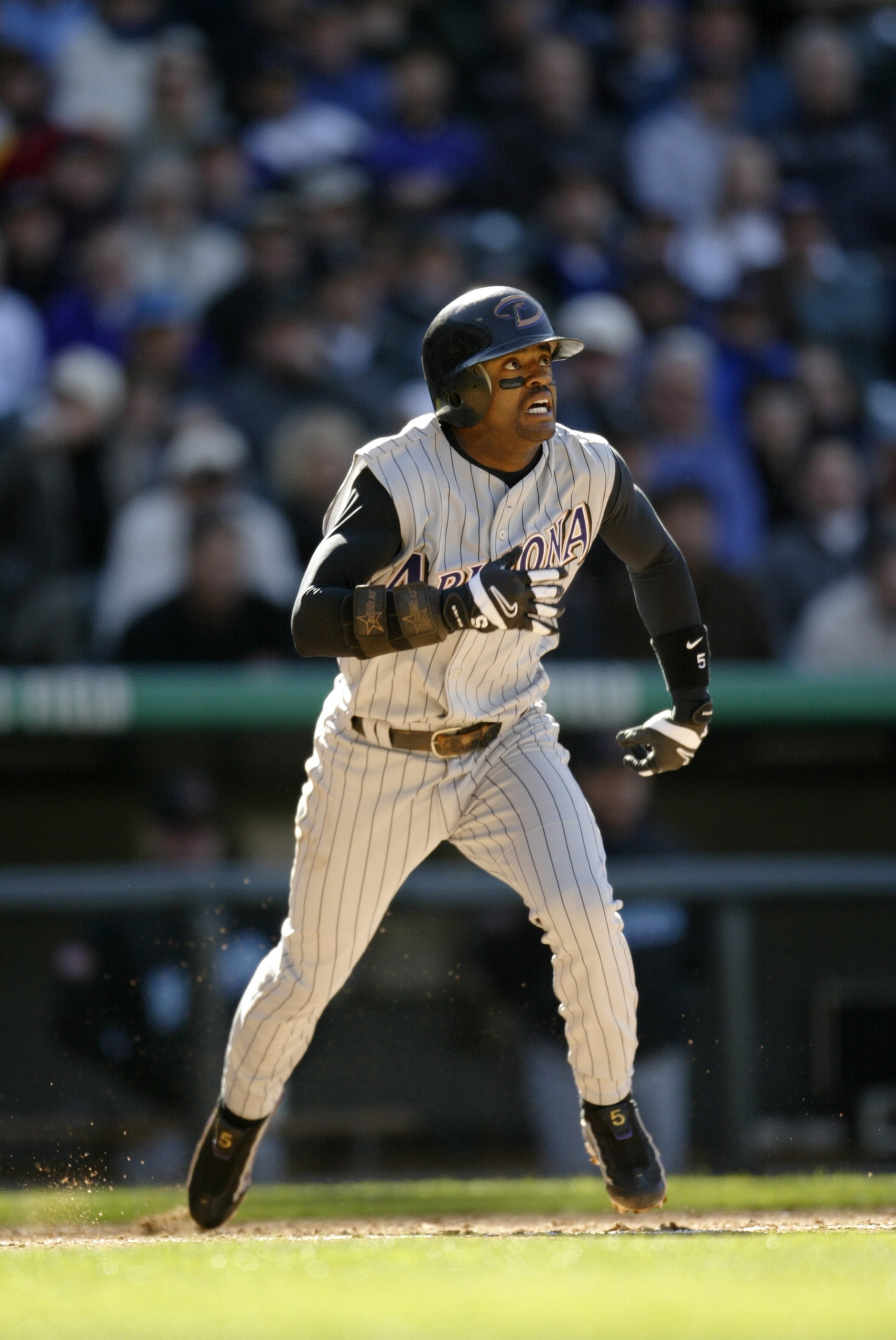 DENVER - APRIL 4:  Tony Womack #5 of the Arizona Diamondbacks runs to first base during the game against the Colorado Rockies at Coors Field on April 4 2003, in Denver, Colorado.  The Rockies defeated the Diamondbacks 2-1.  (Photo by Brian Bahr/Getty Imag