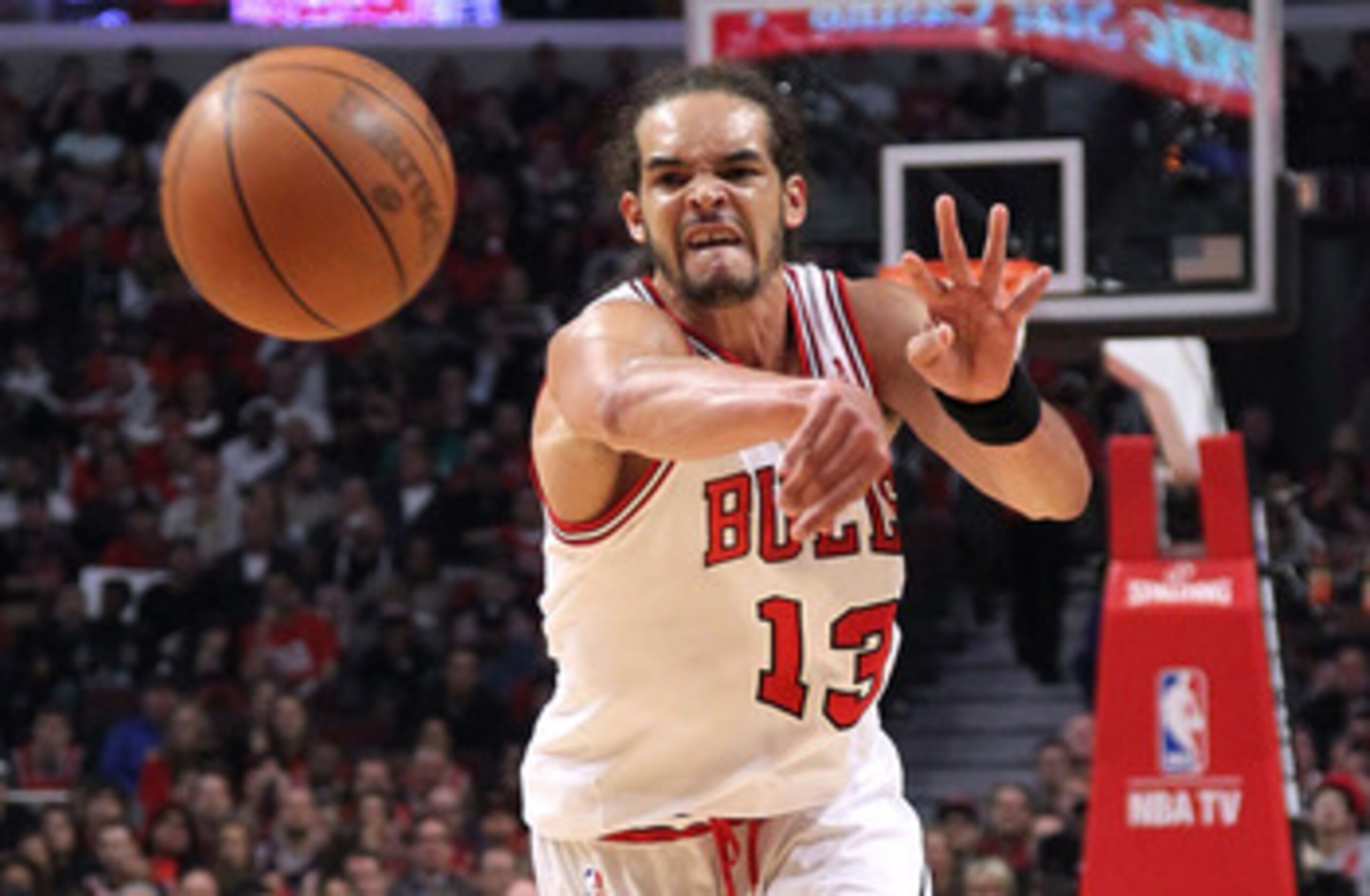 CHICAGO, IL - MAY 26:  Joakim Noah #13 of the Chicago Bulls passes the ball agains the Miami Heat in Game Five of the Eastern Conference Finals during the 2011 NBA Playoffs on May 26, 2011 at the United Center in Chicago, Illinois. NOTE TO USER: User expr