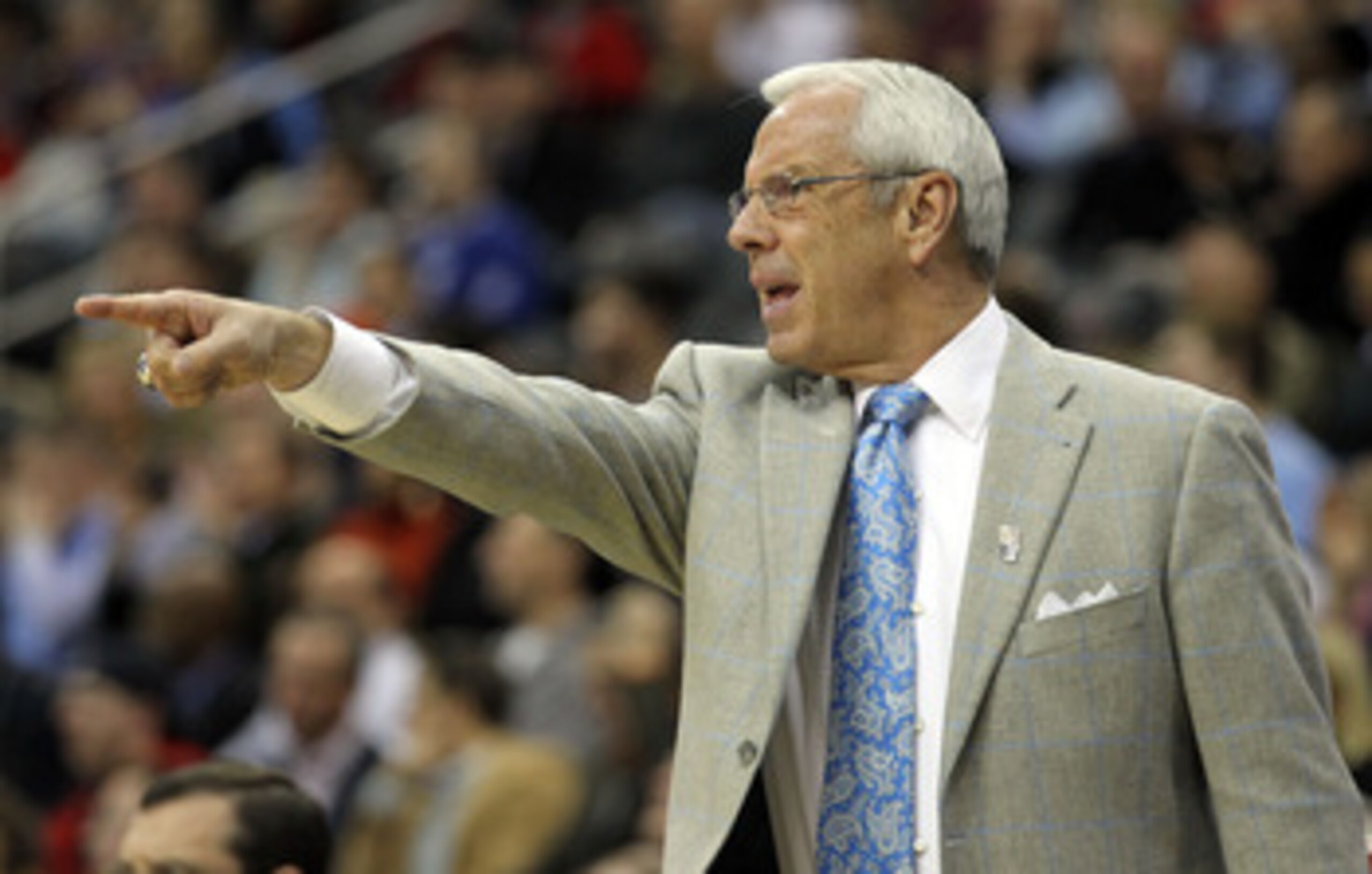 NEWARK, NJ - MARCH 25:  Head coach Roy Williams of the North Carolina Tar Heels points to the court during the first half of the east regional semifinal of the 2011 NCAA Men's Basketball Tournament at the Prudential Center on March 25, 2011 in Newark, New