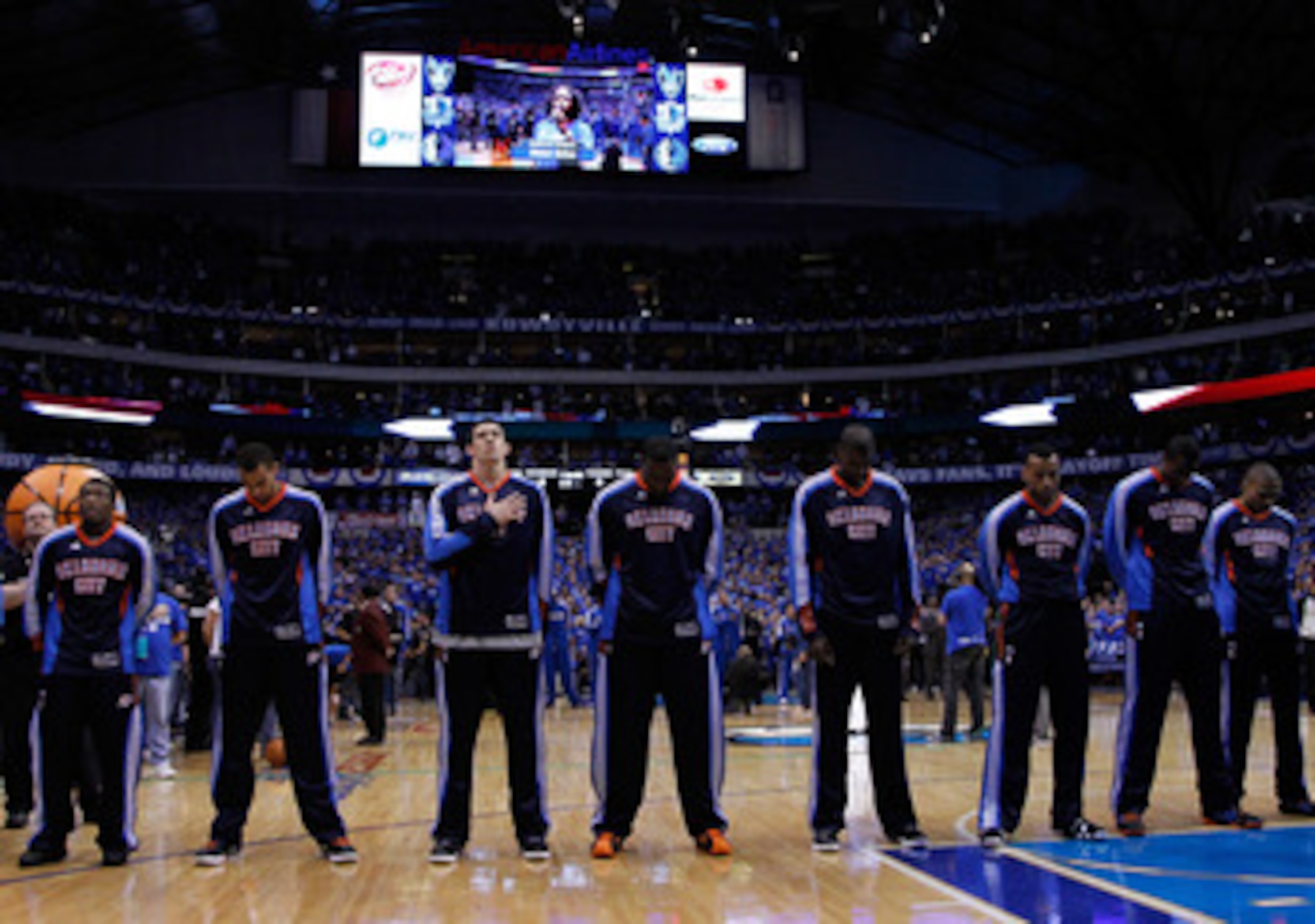 DALLAS, TX - MAY 17: The Oklahoma City Thunder stand during the national anthem before taking on the Dallas Mavericks in Game One of the Western Conference Finals during the 2011 NBA Playoffs at American Airlines Center on May 17, 2011 in Dallas, Texas. DALLAS, TX - MAY 17: The Oklahoma City Thunder stand during the national anthem before taking on the Dallas Mavericks in Game One of the Western Conference Finals during the 2011 NBA Playoffs at American Airlines Center on May 17, 2011 in Dallas, Texas.