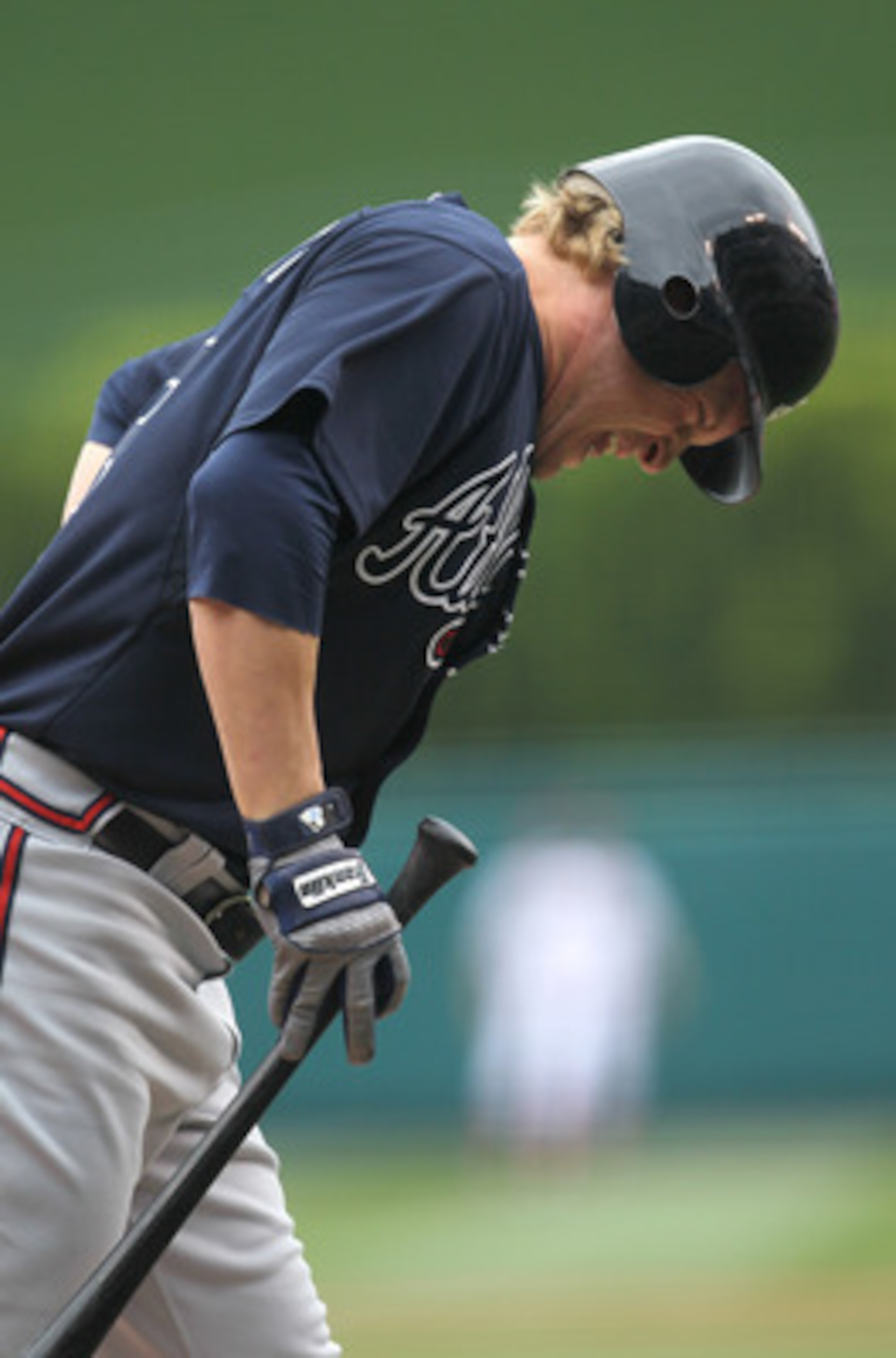ANAHEIM, CA - MAY 22: Nate McLouth #13 of the Atlanta Braves reacts after hitting himself with a foul ball in the first inning against the Los Angeles Angels of Anaheim on May 22, 2011 at Angel Stadium in Anaheim, California. McLouth couldn't continue a ANAHEIM, CA - MAY 22: Nate McLouth #13 of the Atlanta Braves reacts after hitting himself with a foul ball in the first inning against the Los Angeles Angels of Anaheim on May 22, 2011 at Angel Stadium in Anaheim, California. McLouth couldn't continue a