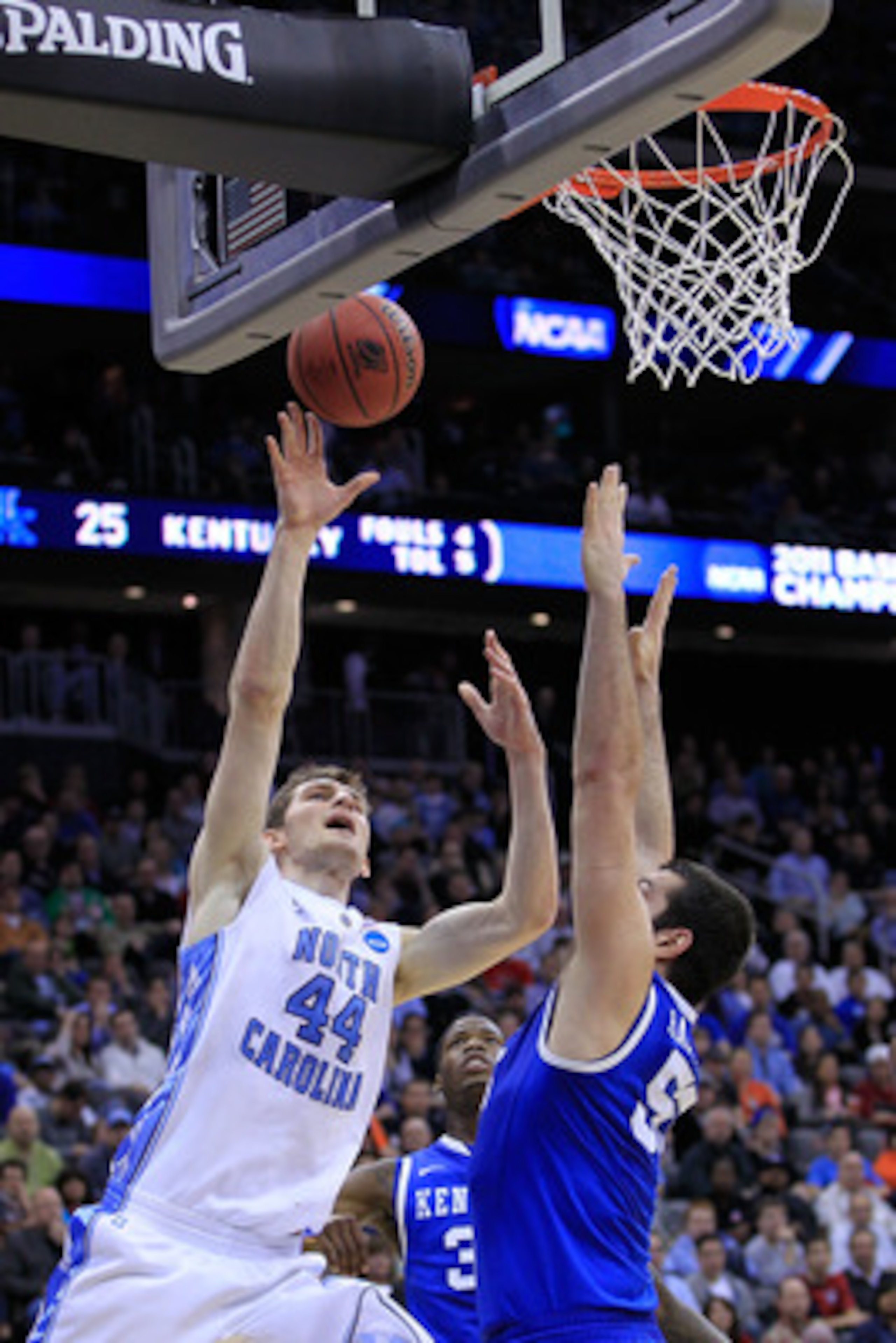 NEWARK, NJ - MARCH 27:  Tyler Zeller #44 of the North Carolina Tar Heels in action against Josh Harrellson #55 of the Kentucky Wildcats during the east regional final of the 2011 NCAA men's basketball tournament at Prudential Center on March 27, 2011 in N