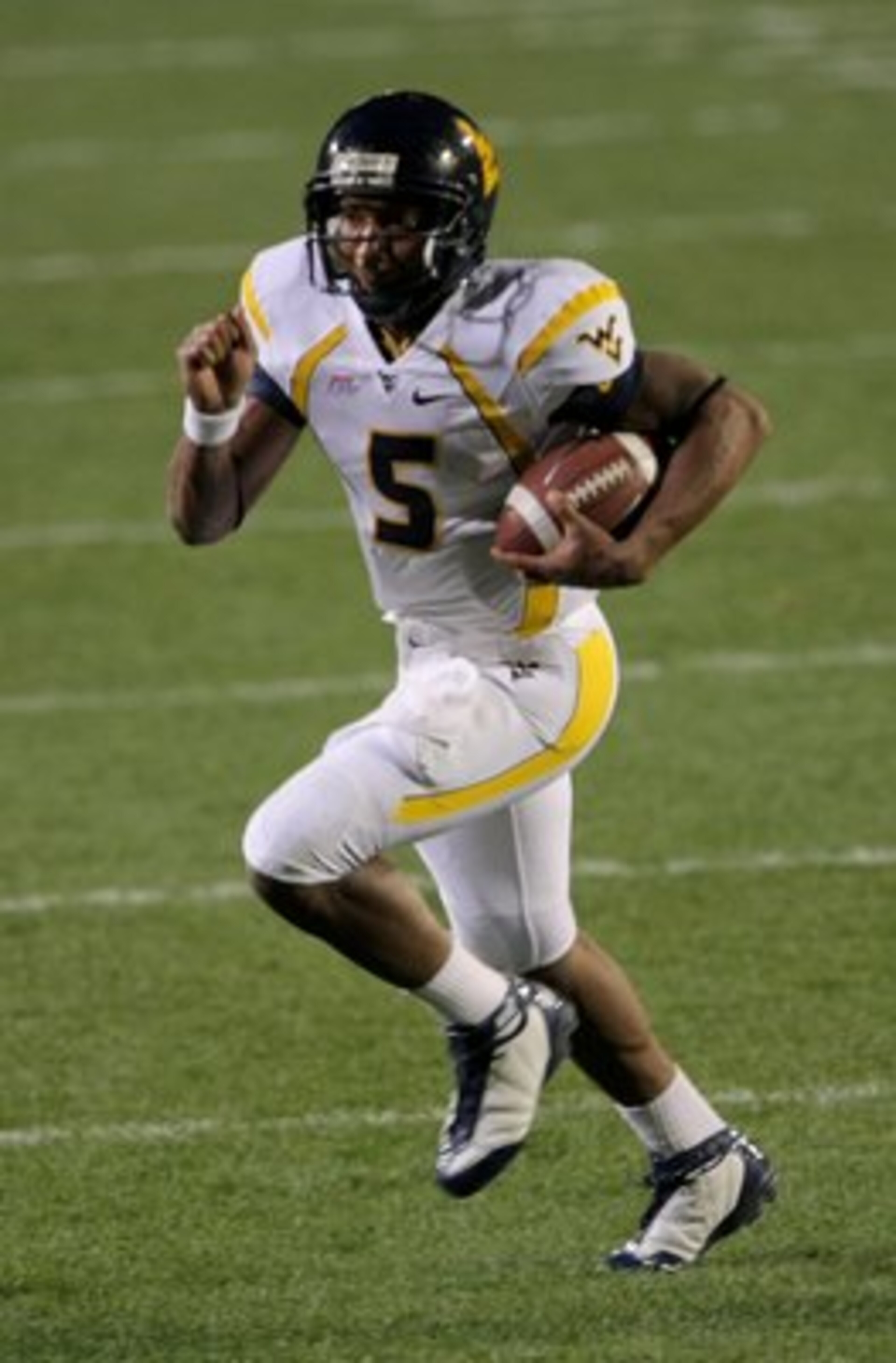 BOULDER, CO - SEPTEMBER 18:  Quarterback Pat White #5 of the West Virginia Mountaineers rushes against the Colorado Buffaloes at Folsom Field on September 18, 2008 in Boulder, Colorado. Colorado defeated West Virginia 17-14 in overtime.  (Photo by Doug Pe
