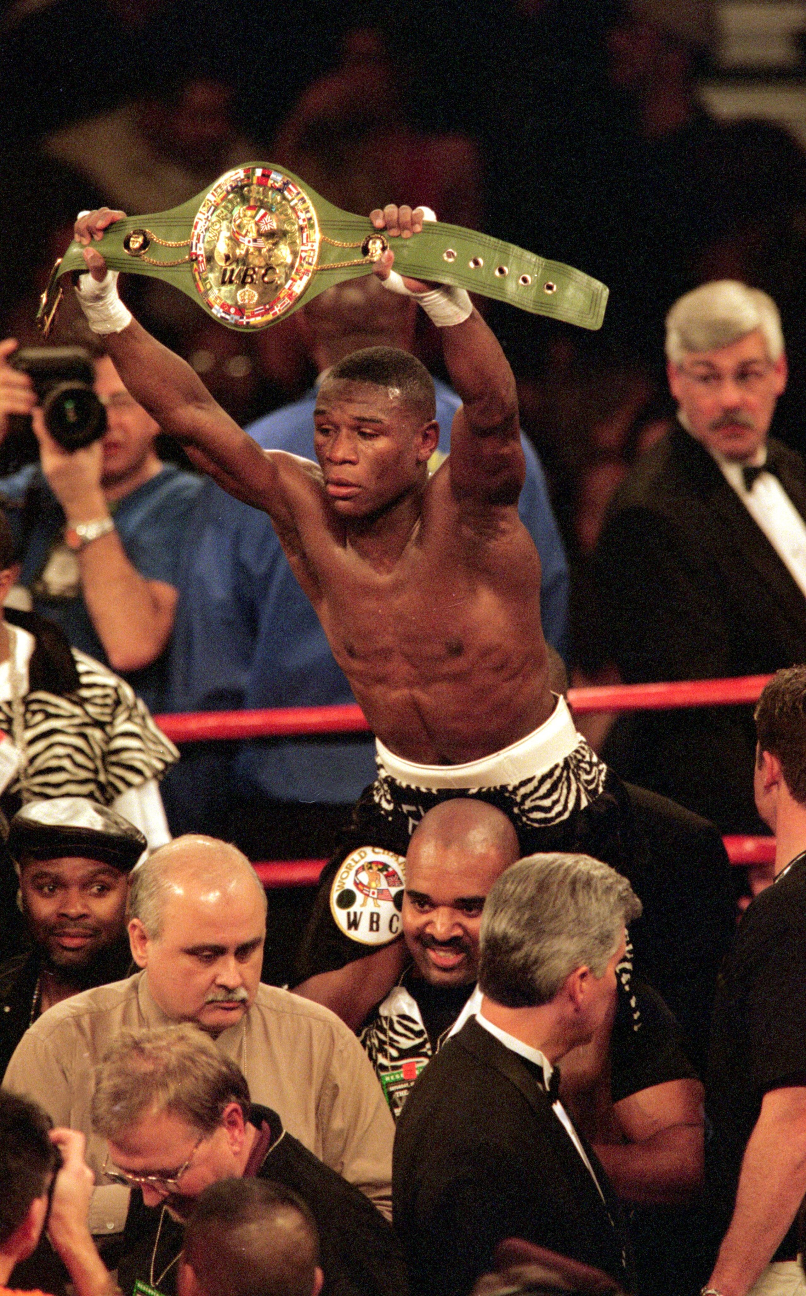 20 Jan 2001:  Floyd Mayweather hold his belt after up defeating Diego Corrales at the MGM Grand Garden Arena in Las Vegas, Nevada. Mandatory Credit: Jeff Gross  /Allsport