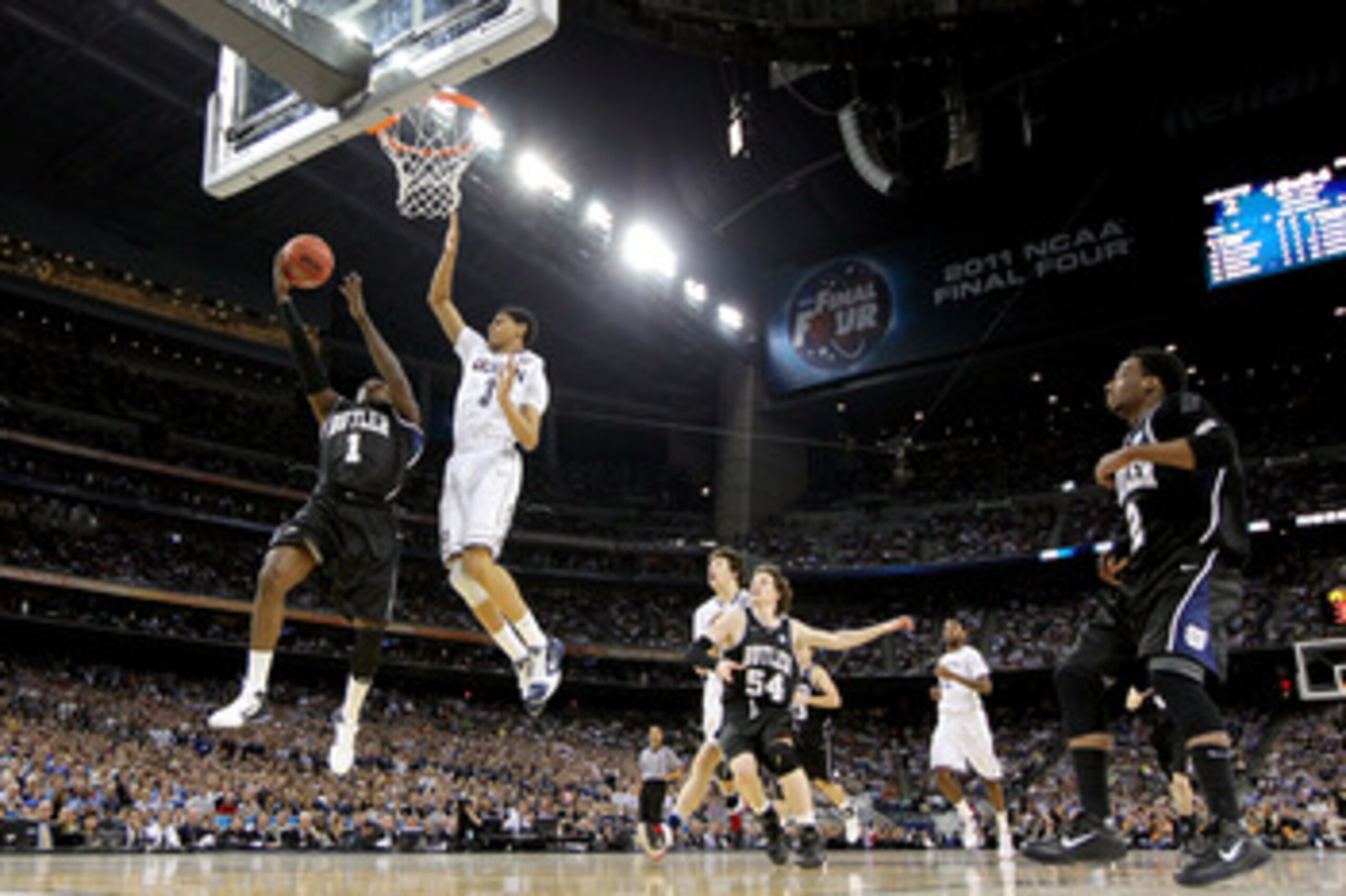 HOUSTON, TX - APRIL 04:  Shelvin Mack #1 of the Butler Bulldogs goes to the basket against Jeremy Lamb #3 of the Connecticut Huskies during the National Championship Game of the 2011 NCAA Division I Men's Basketball Tournament at Reliant Stadium on April
