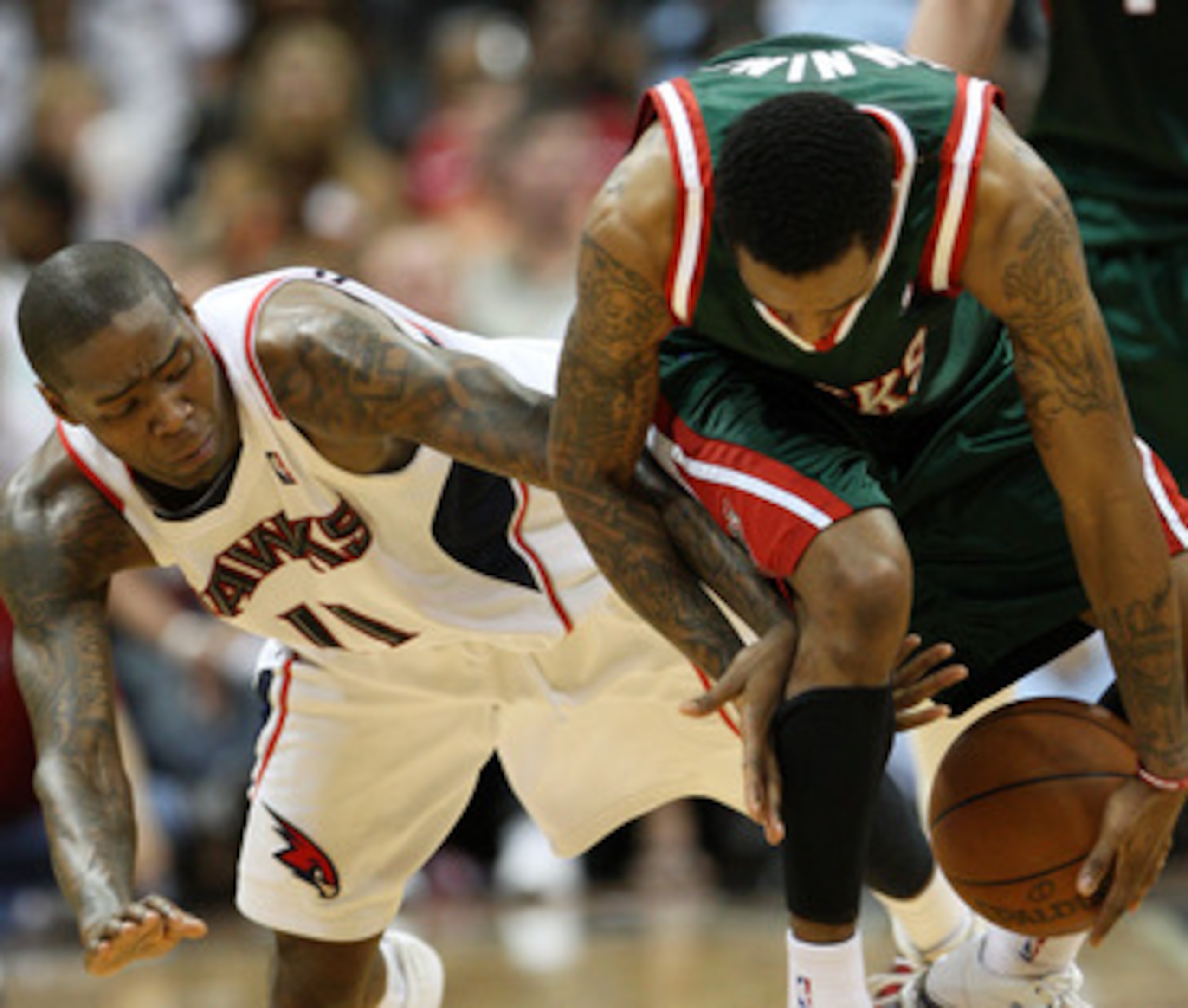 ATLANTA - MAY 2:  Guard Jamal Crawford #11 of the Atlanta Hawks defends guard Brandon Jennings #3 of the Milwaukee Bucks during Game Seven of the Eastern Conference Quarterfinals during the 2010 NBA Playoffs at Philips Arena on May 2, 2010 in Atlanta, Geo