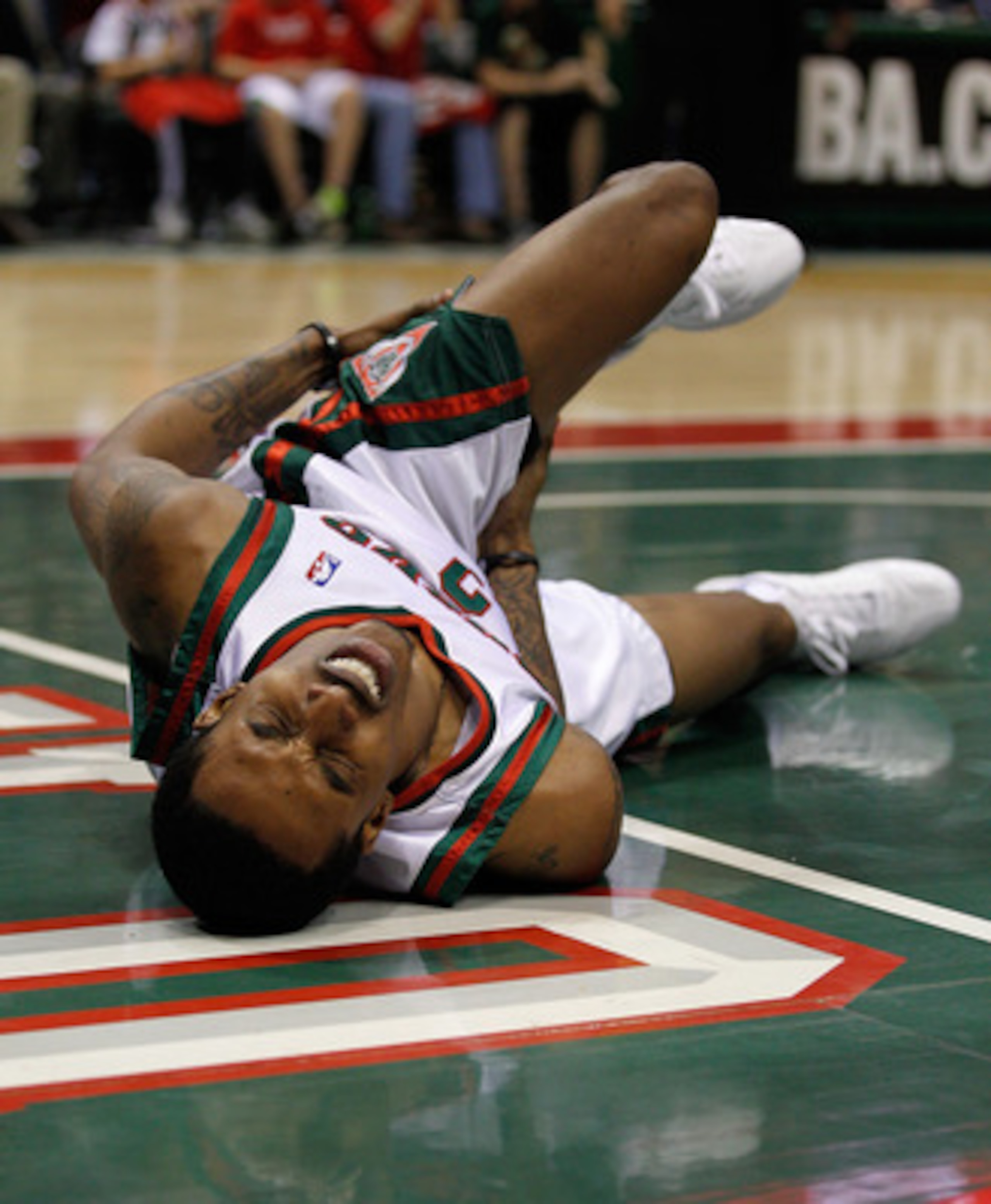 MILWAUKEE - APRIL 30: Brandon Jennings #3 of the Milwaukee Bucks grabs his leg after hitting the floor hard against the Atlanta Hawks in Game Six of the Eastern Conference Quarterfinals during the 2010 NBA Playoffs at the Bradley Center on April 30, 2010 