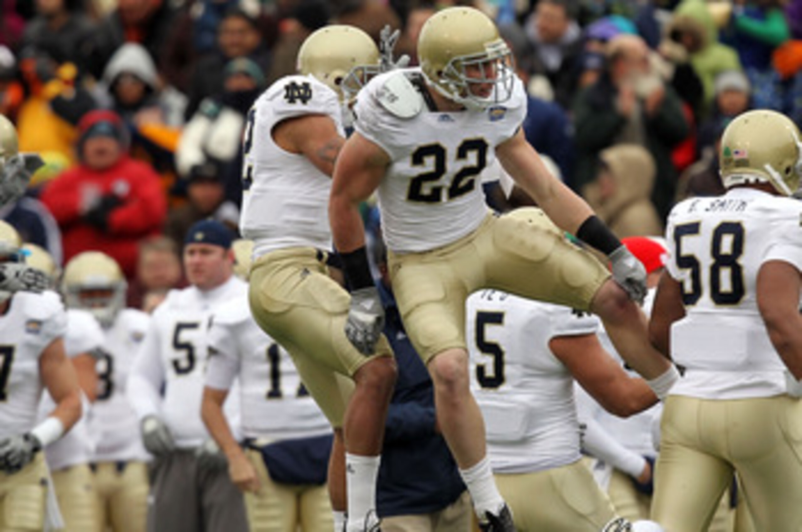 EL PASO, TX - DECEMBER 30:  Safety Harrison Smith #22 celebrates a pass interception with Robert Blanton #12 of the Notre Dame Fighting Irish during play against the Miami Hurricanes at Sun Bowl on December 30, 2010 in El Paso, Texas.  (Photo by Ronald Ma