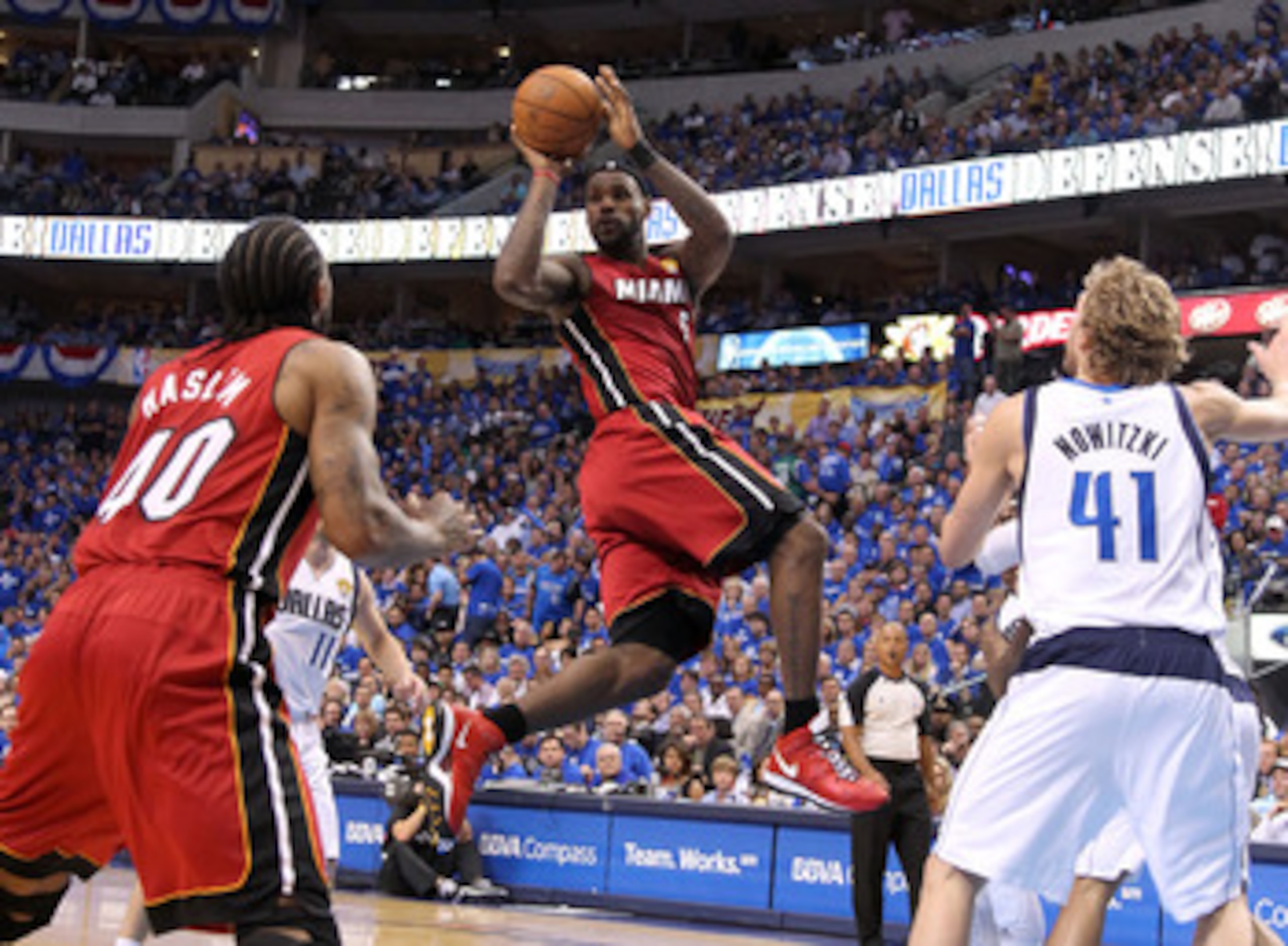 DALLAS, TX - JUNE 07:  LeBron James #6 of the Miami Heat looks to pass the ball against Dirk Nowitzki #41 of the Dallas Mavericks in the first half of Game Four of the 2011 NBA Finals at American Airlines Center on June 7, 2011 in Dallas, Texas. NOTE TO U