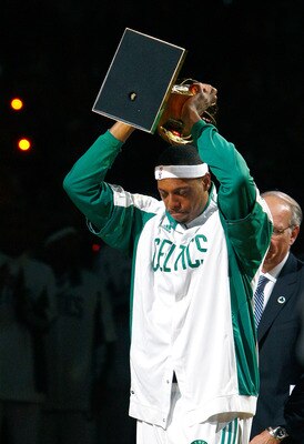 BOSTON, MA - OCTOBER 28: Paul Pierce #34 of the Boston Celtics raise the 2008 World Championship trophy during the 2008 NBA World Championship ceremony before a game against the Cleveland Cavaliersat the TD Banknorth Garden on October 28, 2008 in Boston, 