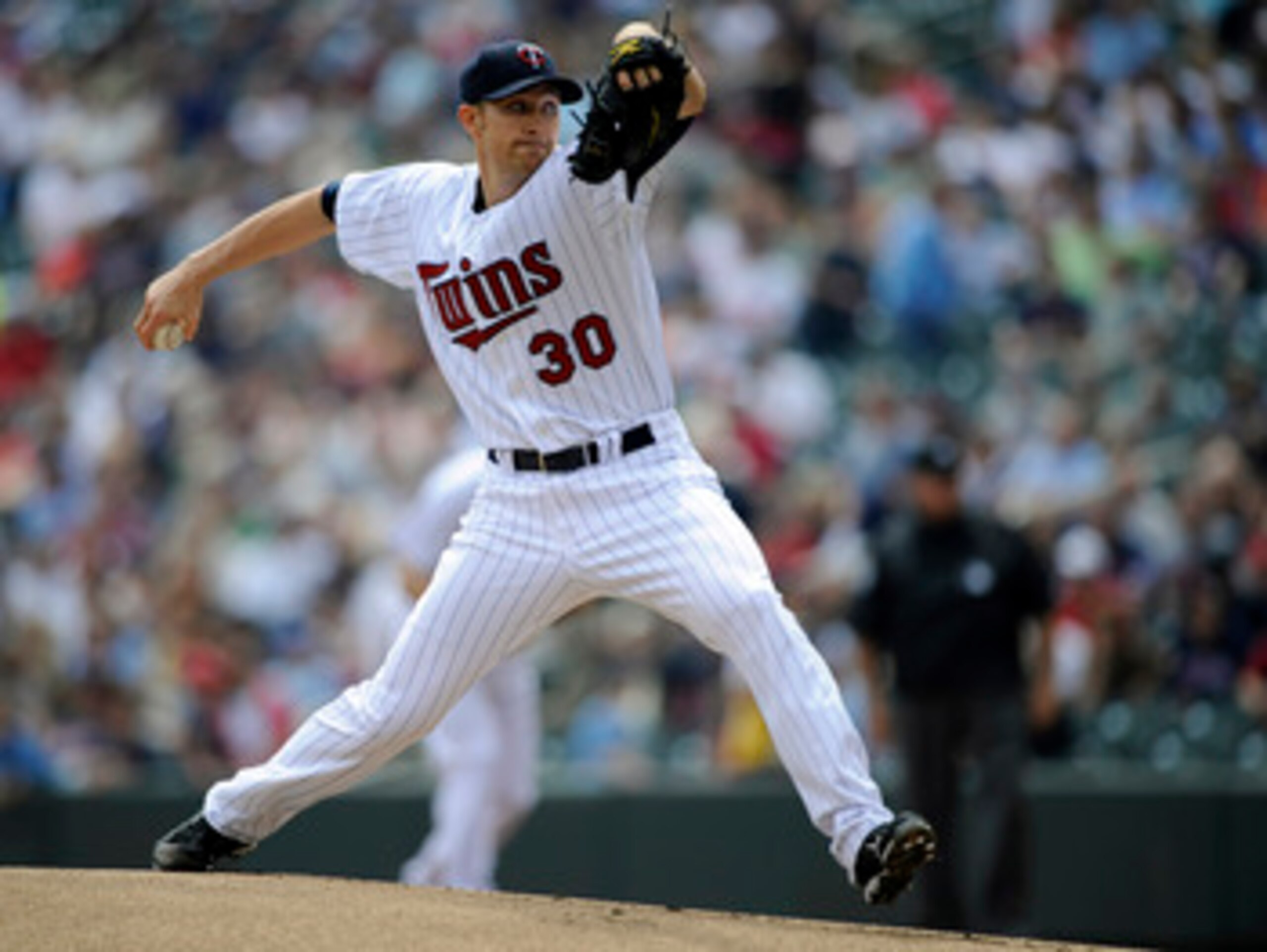 MINNEAPOLIS, MN - MAY 11: Scott Baker #30 of the Minnesota Twins pitches against the Detroit Tigers during in the first inning of their game on May 11, 2011 at Target Field in Minneapolis, Minnesota. (Photo by Hannah Foslien/Getty Images)