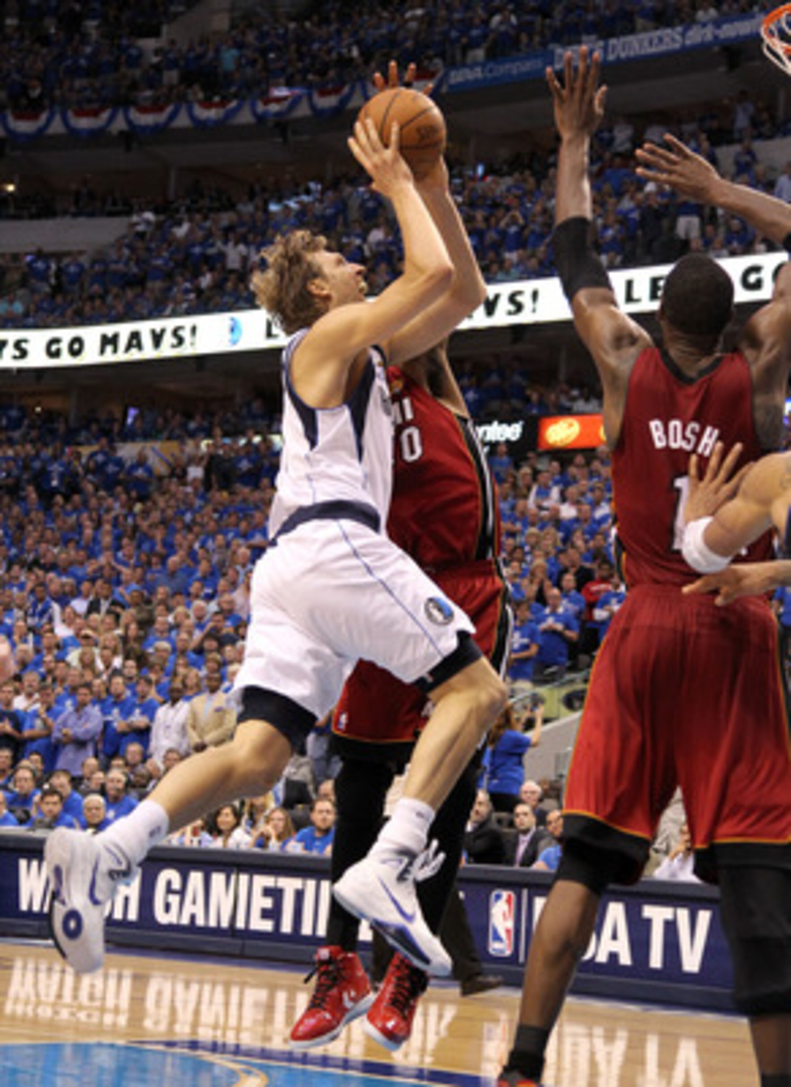 DALLAS, TX - JUNE 07:  Dirk Nowitzki #41 of the Dallas Mavericks drives for a shot attempt against the Miami Heat in Game Four of the 2011 NBA Finals at American Airlines Center on June 7, 2011 in Dallas, Texas. NOTE TO USER: User expressly acknowledges a