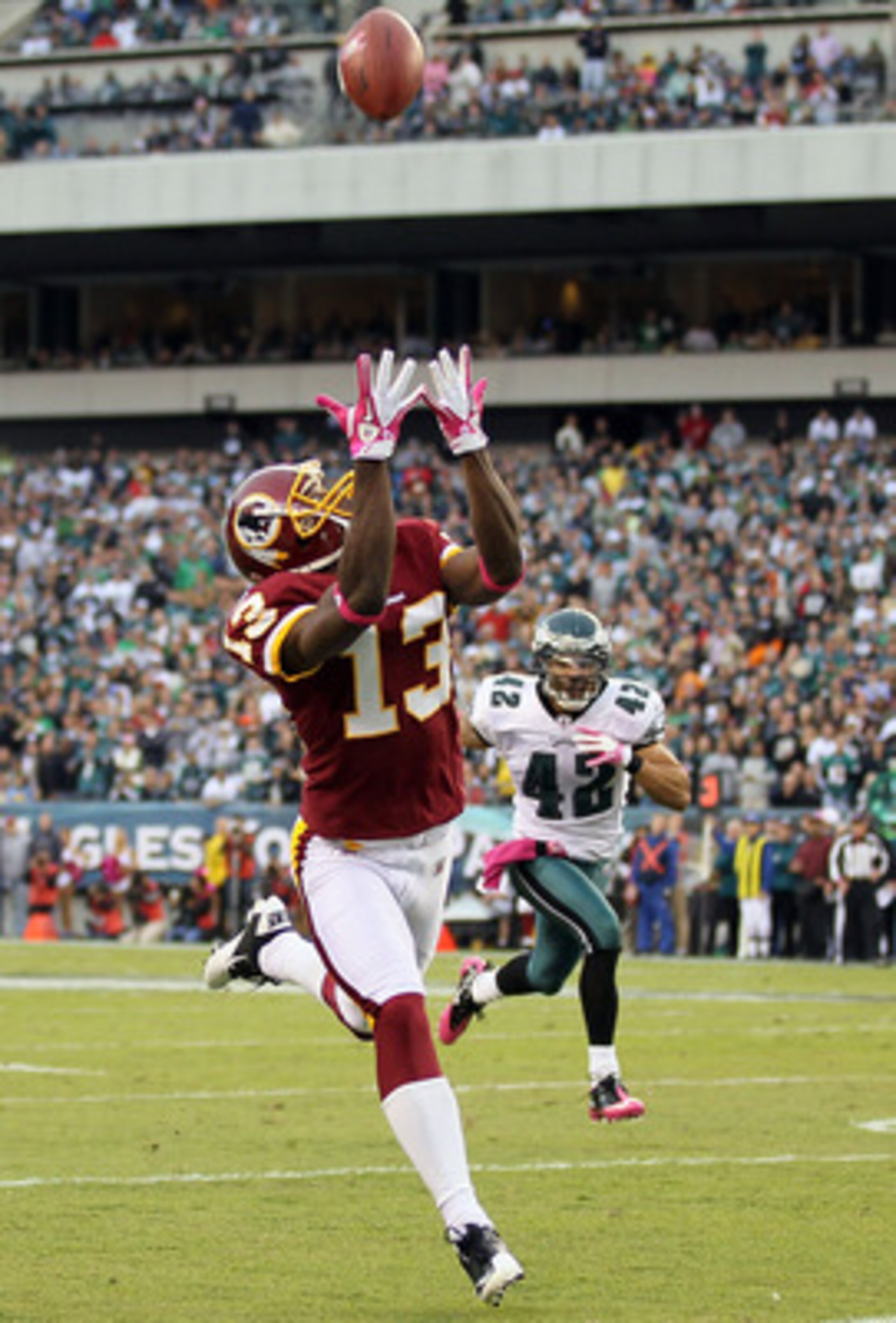 PHILADELPHIA - OCTOBER 03:  Anthony Armstrong #13 of the Washington Redskins makes a long reception against Kurt Coleman #42 of the Philadelphia Eagles on October 3, 2010 at Lincoln Financial Field in Philadelphia, Pennsylvania.  (Photo by Jim McIsaac/Get