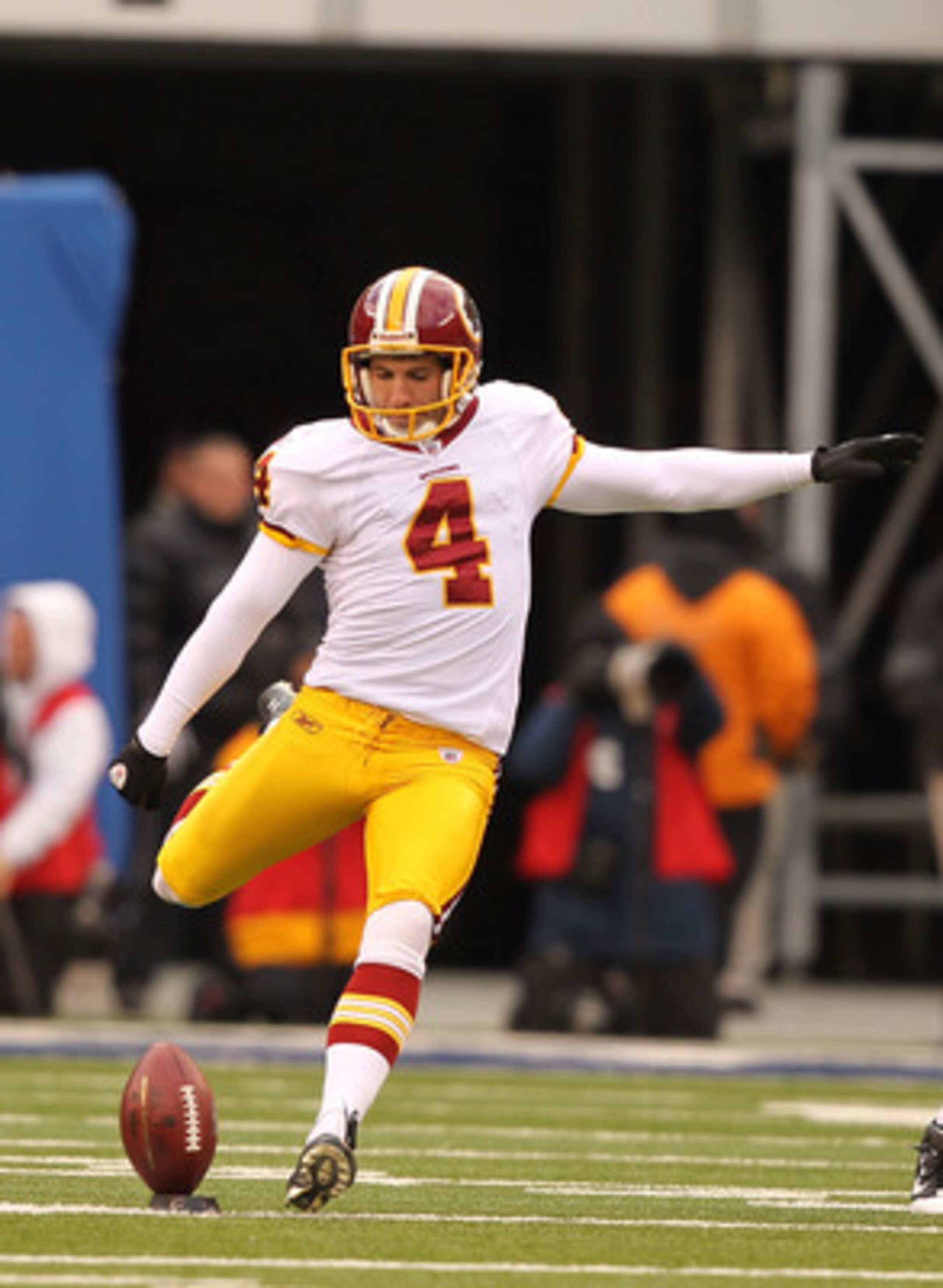 EAST RUTHERFORD, NJ - DECEMBER 05: Graham Gano #4 of the Washington Redskins kicks the ball against the New York Giants during their game on December 5, 2010 at The New Meadowlands Stadium in East Rutherford, New Jersey.  (Photo by Al Bello/Getty Images)