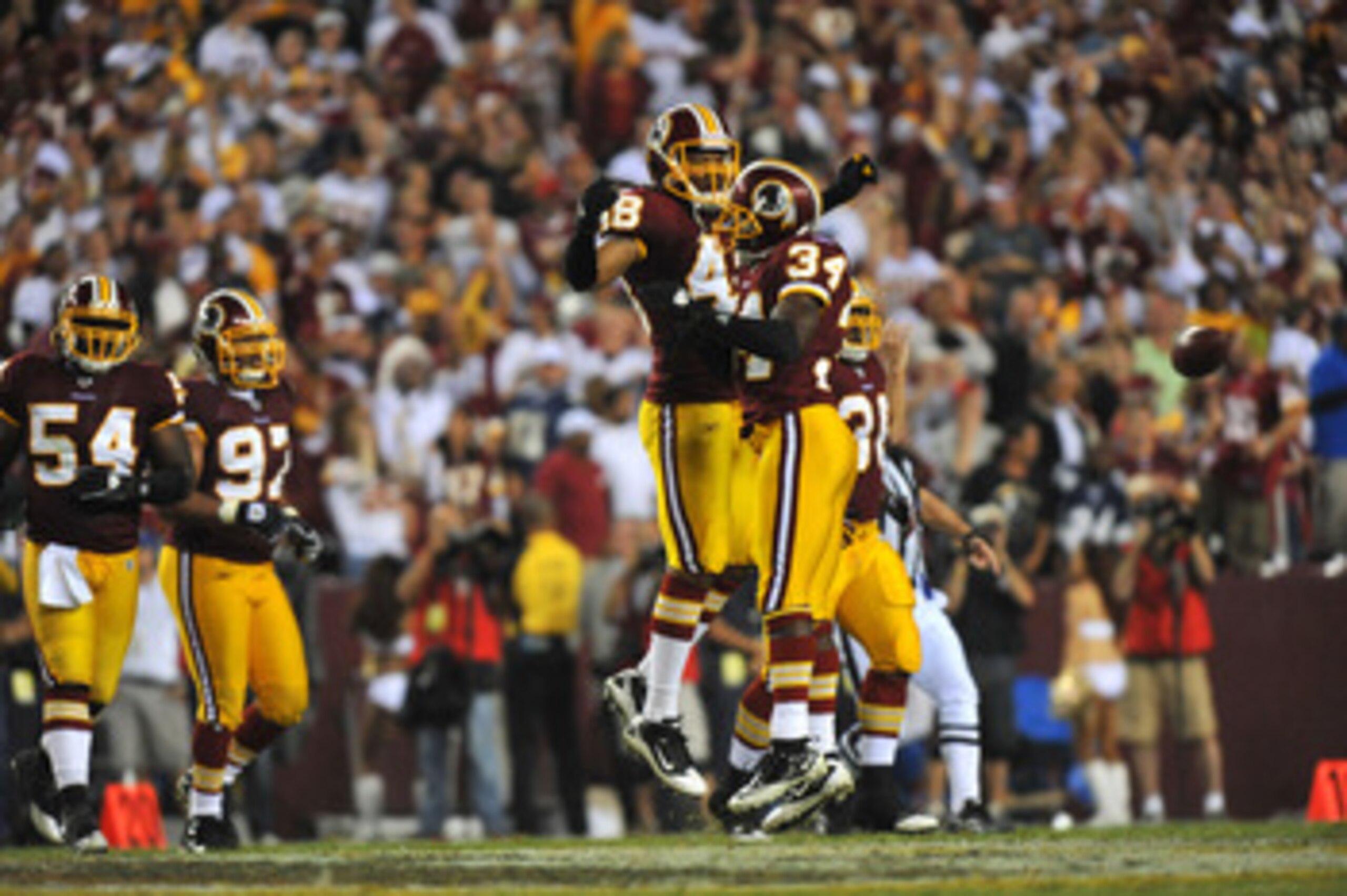 LANDOVER - SEPTEMBER 12:  Byron Westbrook #34 and Chris Horton #45 of the Washington Redskins celebrate a play during the NFL season opener against the Dallas Cowboys at FedExField on September 12, 2010 in Landover, Maryland. The Redskins defeated the Cow