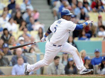 LOS ANGELES, CA - MAY 14: Juan Uribe #5 of the Los Angeles Dodgers strikesout at the plate against the Arizona Diamondbacks at Dodger Stadium on May 14, 2011 in Los Angeles, California. (Photo by Harry How/Getty Images) LOS ANGELES, CA - MAY 14: Juan Uribe #5 of the Los Angeles Dodgers strikesout at the plate against the Arizona Diamondbacks at Dodger Stadium on May 14, 2011 in Los Angeles, California. (Photo by Harry How/Getty Images)
