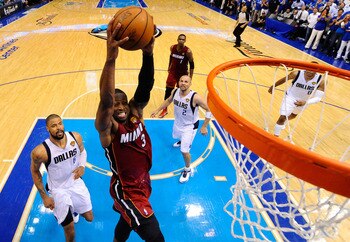 DALLAS, TX - JUNE 07:  Dwyane Wade #3 of the Miami Heat dunks against the Dallas Mavericks in Game Four of the 2011 NBA Finals at American Airlines Center on June 7, 2011 in Dallas, Texas. NOTE TO USER: User expressly acknowledges and agrees that, by down