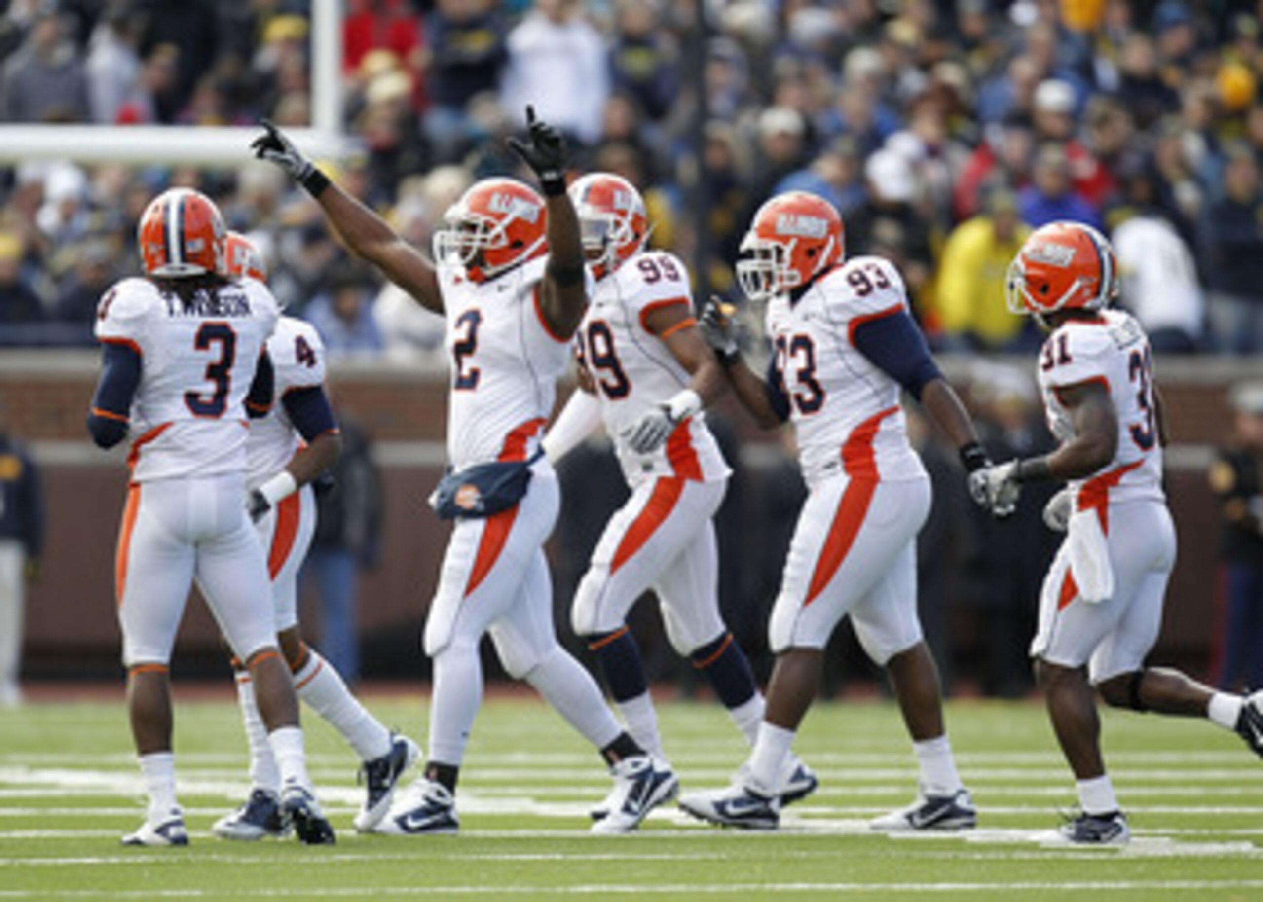 ANN ARBOR, MI - NOVEMBER 06:  Martez Wilson #2 of the Illinois Fighting Illini celebrates a first quarter interception with teammates while playing the Michigan Wolverines at Michigan Stadium on November 6, 2010 in Ann Arbor, Michigan.  (Photo by Gregory