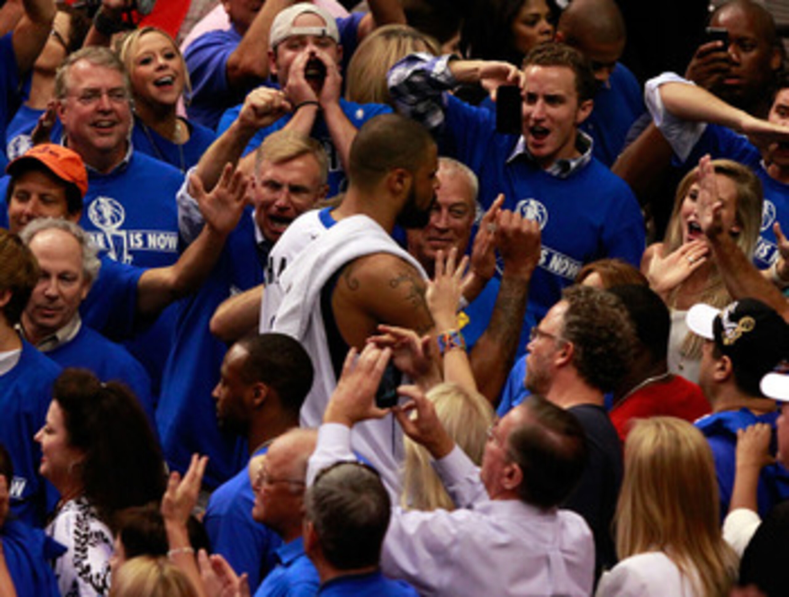 DALLAS, TX - JUNE 07:  Tyson Chandler #6 of the Dallas Mavericks celebrates with fans as he walks off the court after the Mavericks won 86-83 against the Miami Heat in Game Four of the 2011 NBA Finals at American Airlines Center on June 7, 2011 in Dallas,